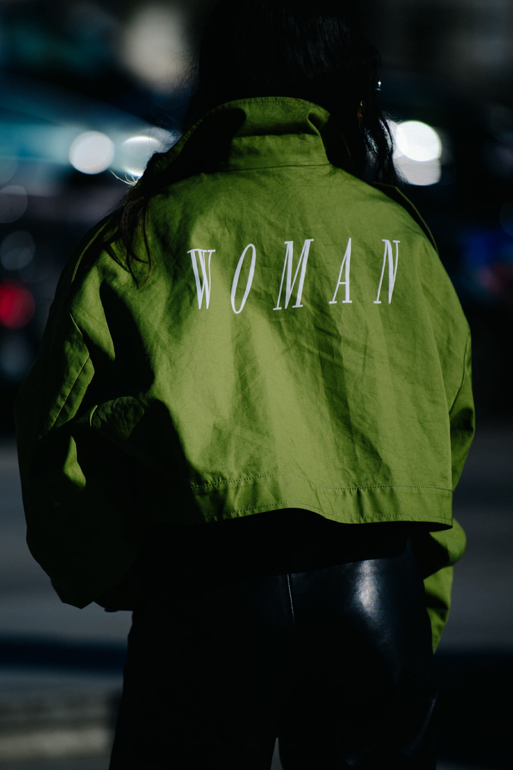 Woman wearing green Off-White top