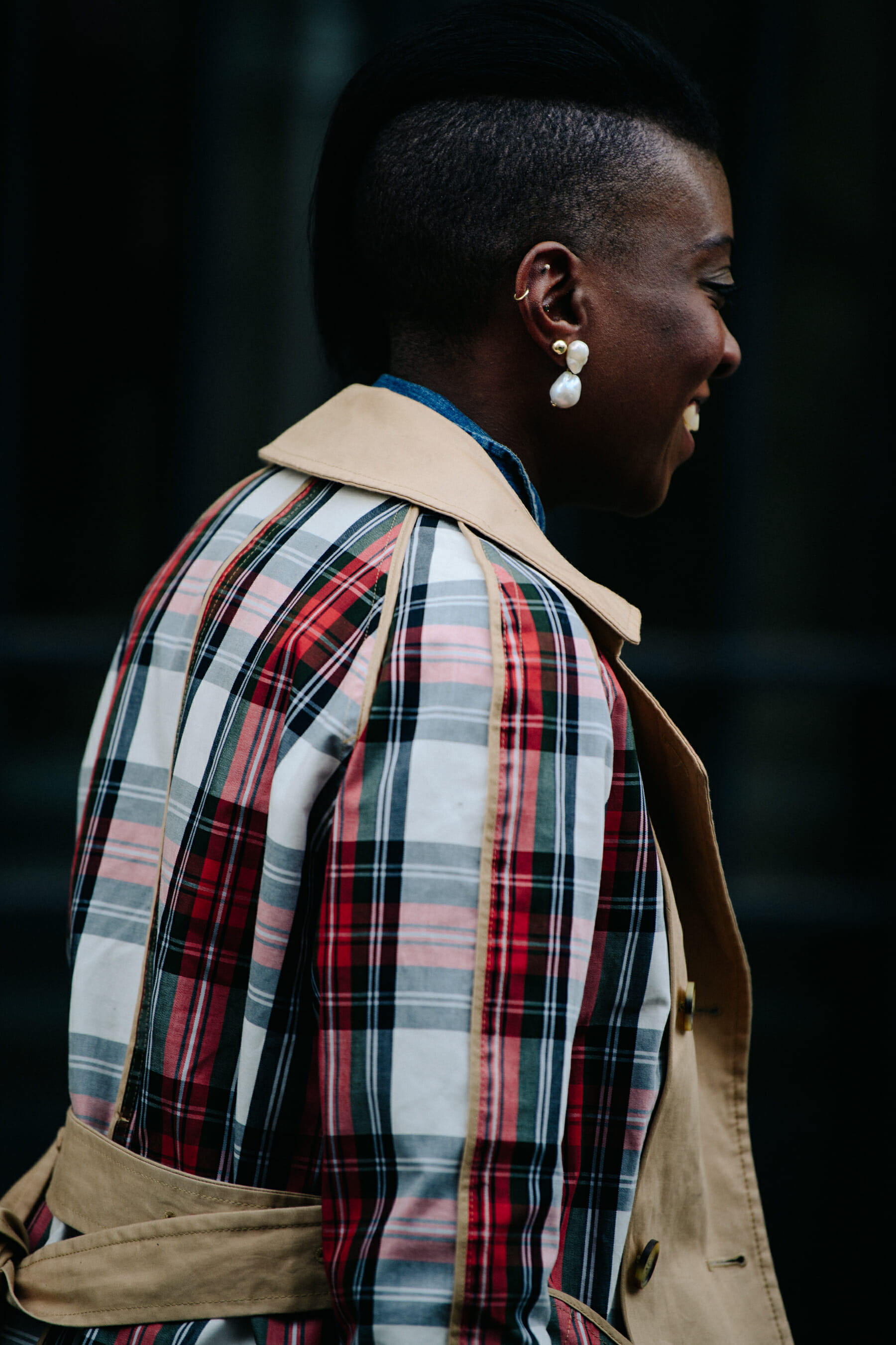 Woman wearing check trench coat