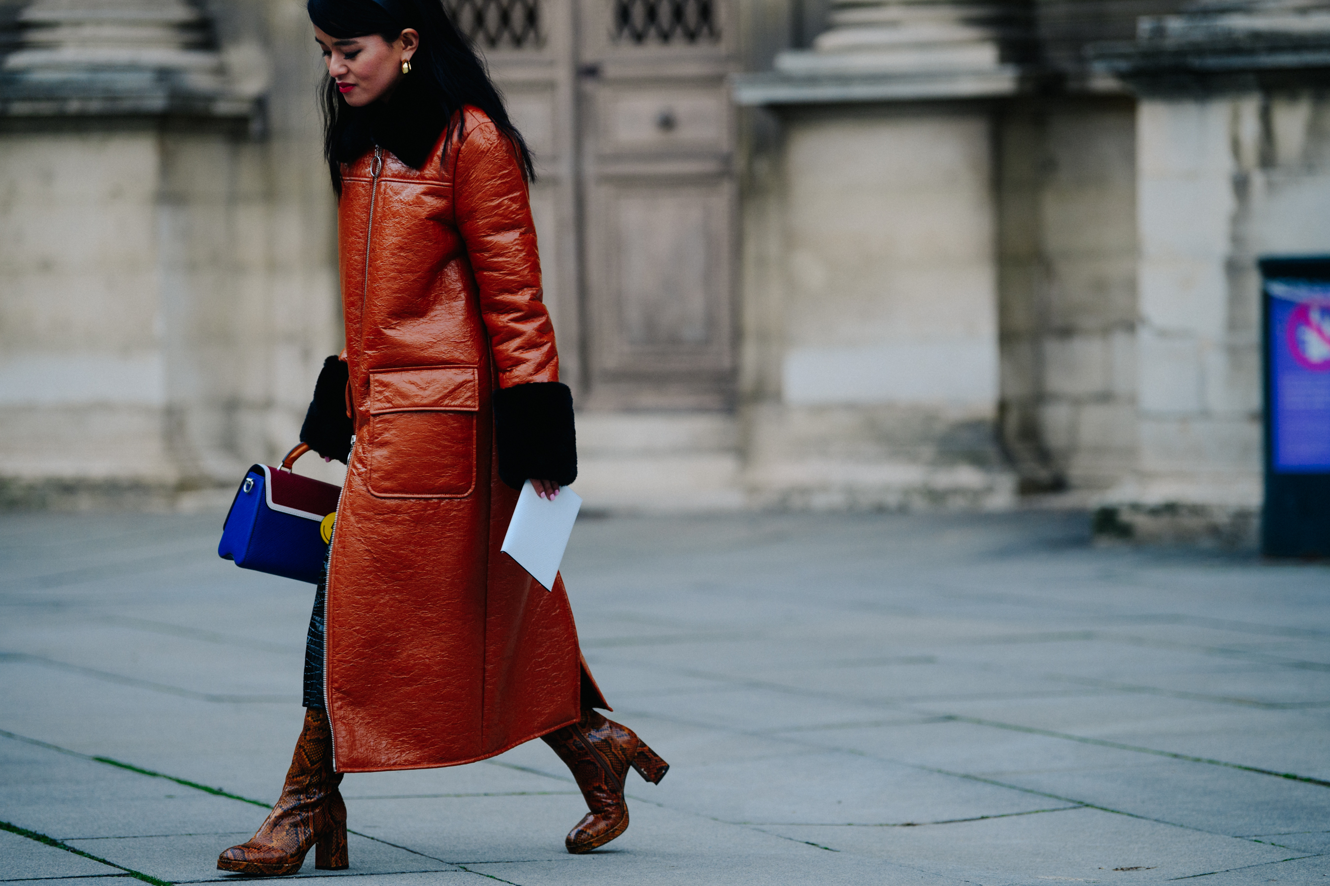 Woman wearing long leather coat