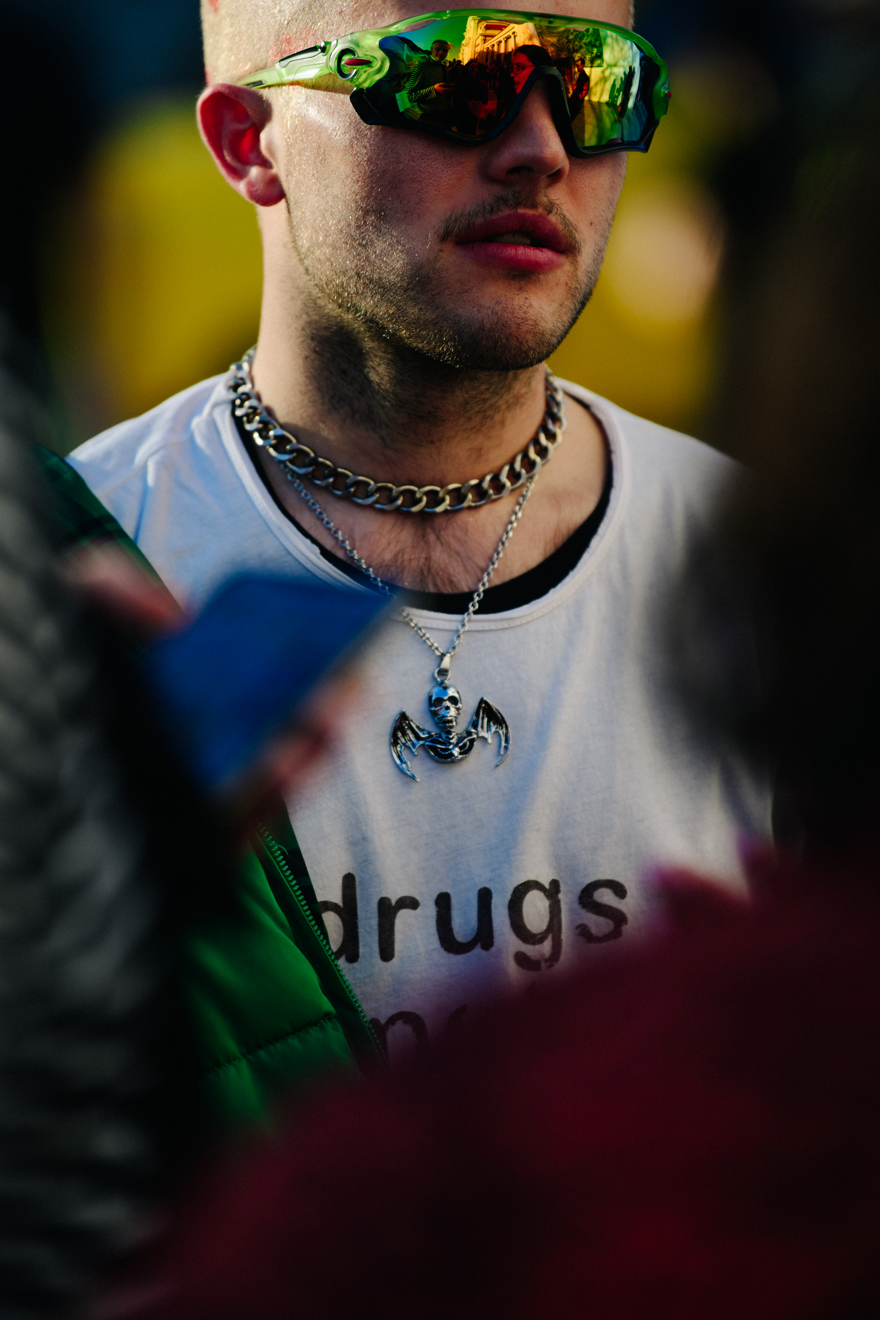 Man wearing green Oakley glasses