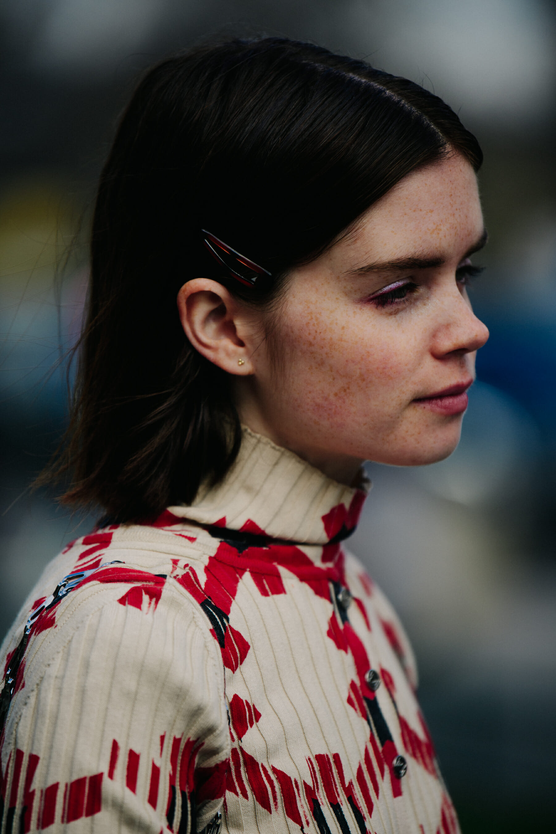 Woman wearing white and red top