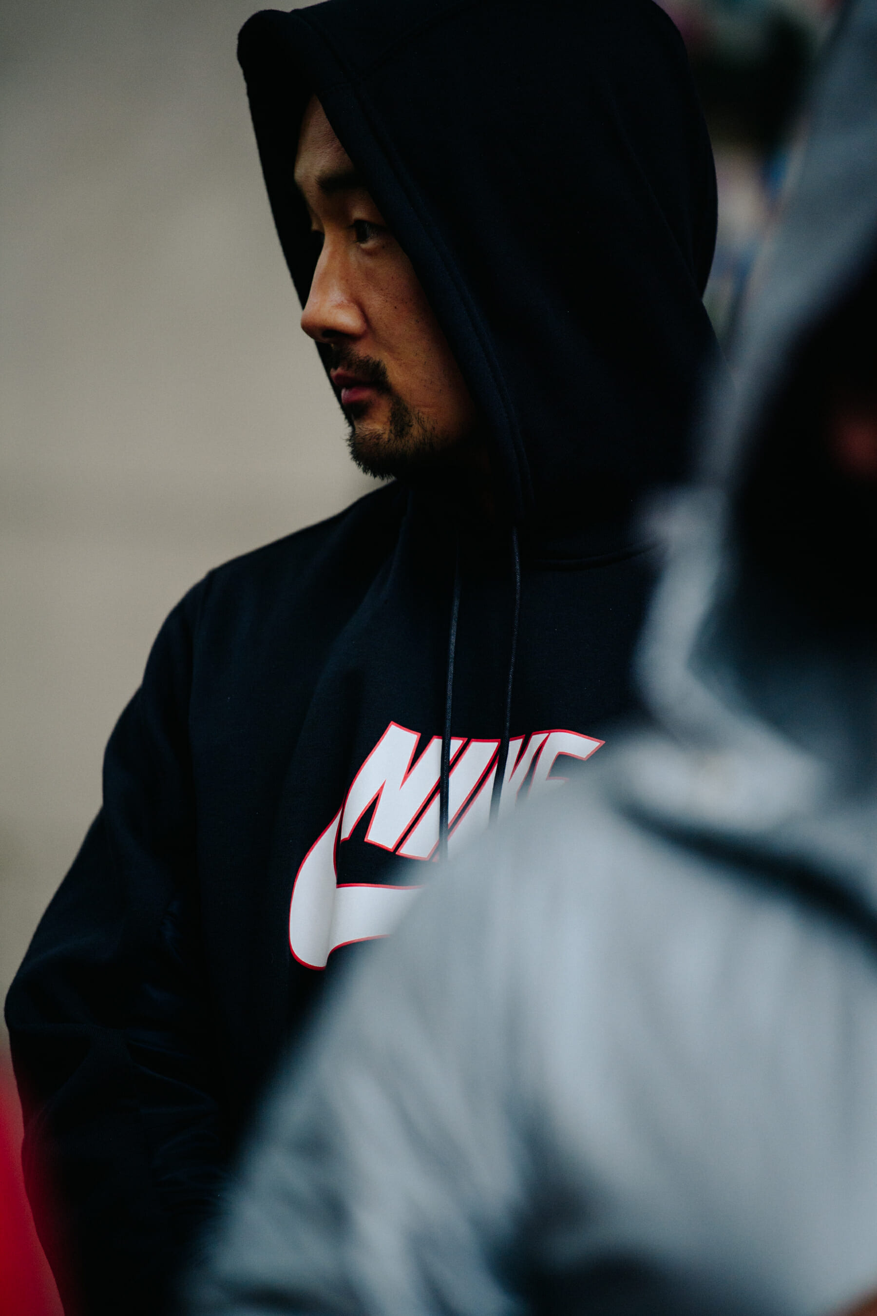 Man wearing black Nike hoodie