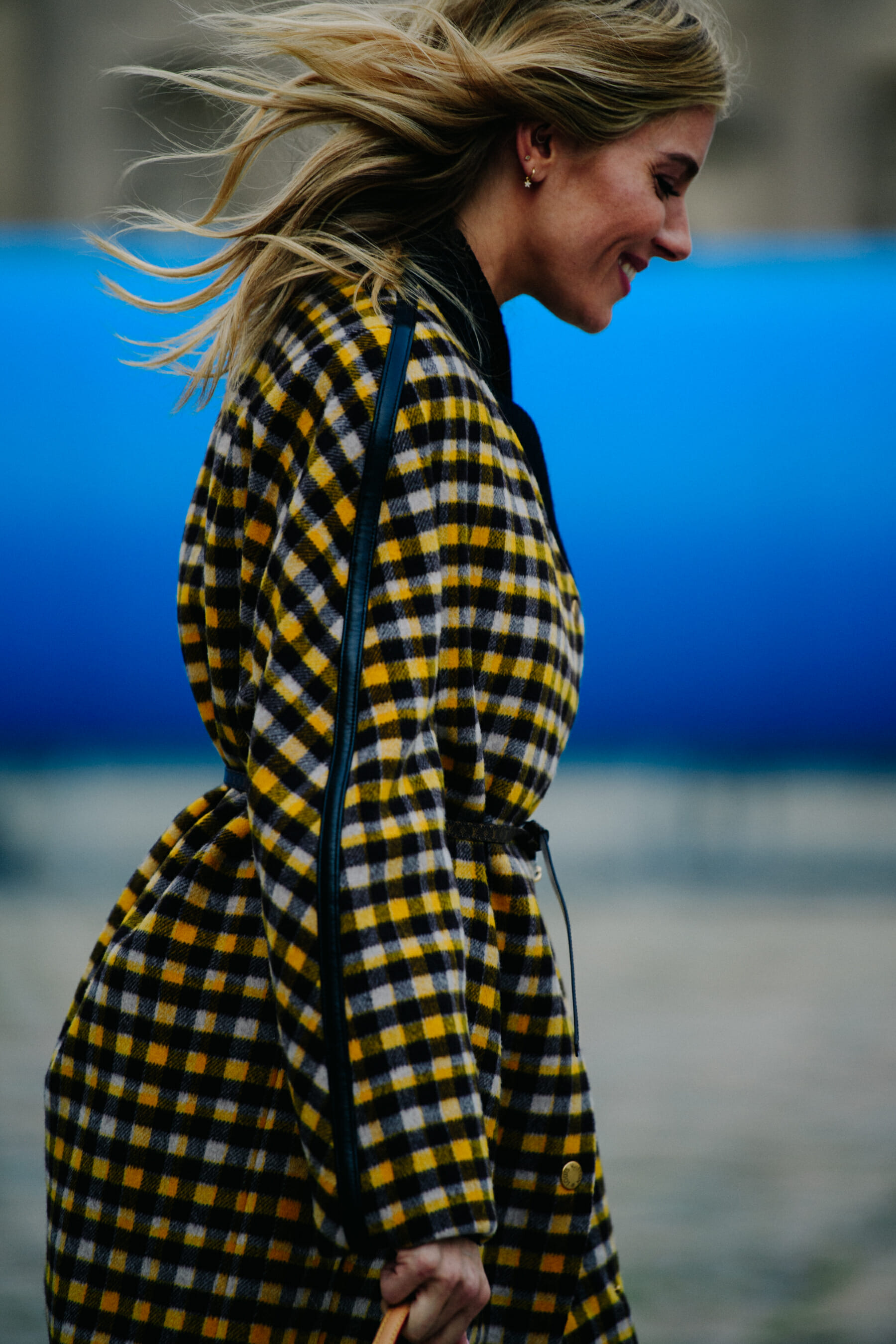 Woman wearing check yellow coat