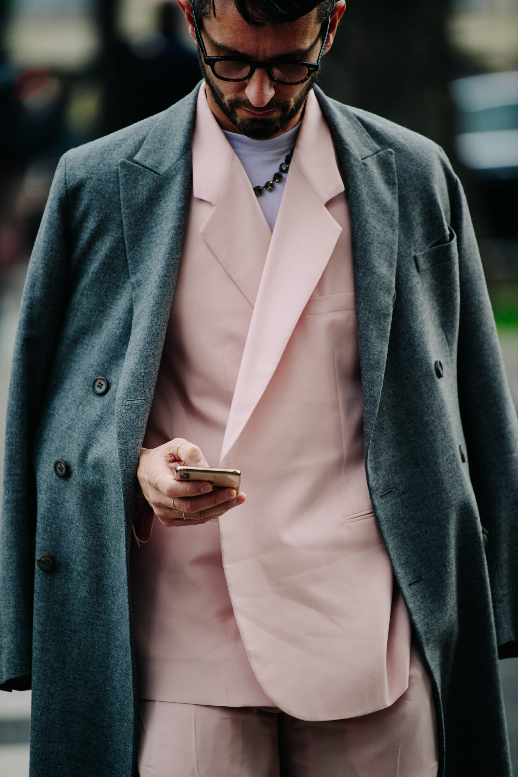Man wearing pink suit jacket