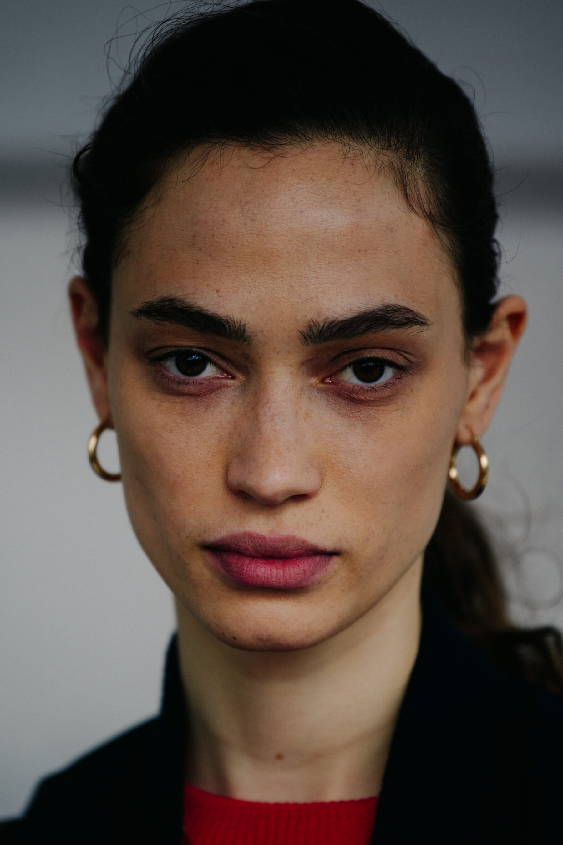 Portrait of model with thick dark hair