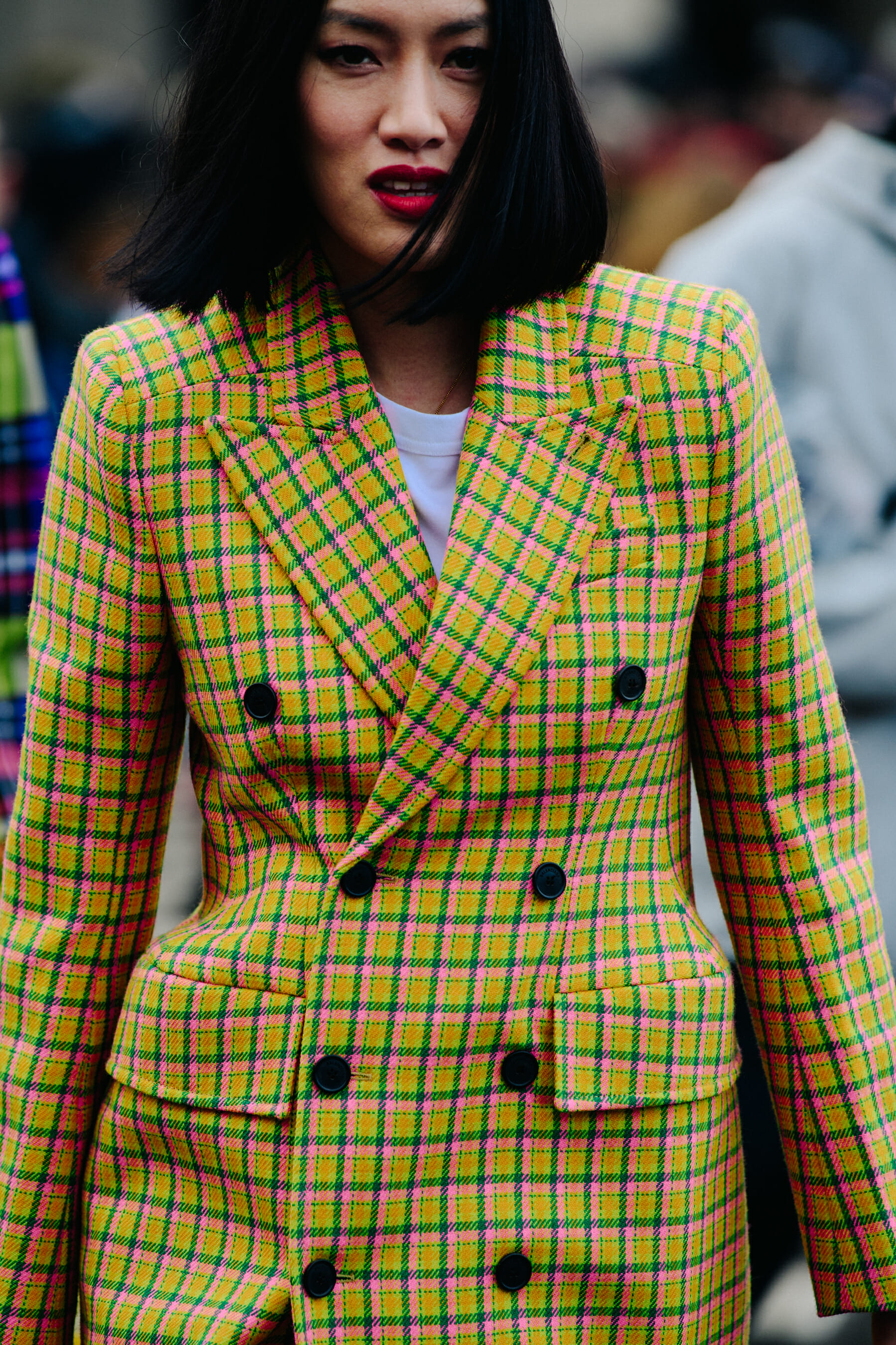 Woman wearing colourful check jacket