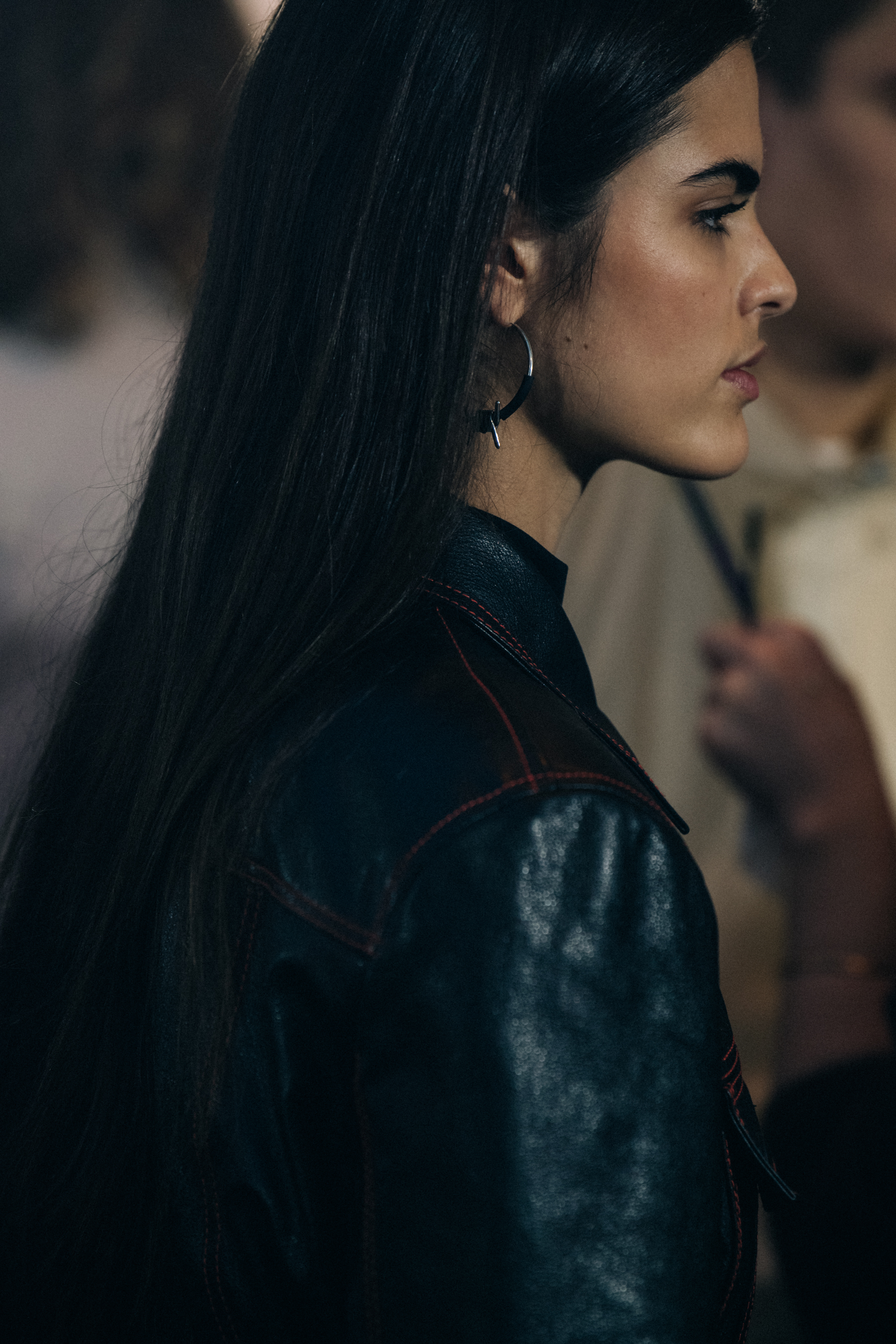 Model wearing black and orange outfit