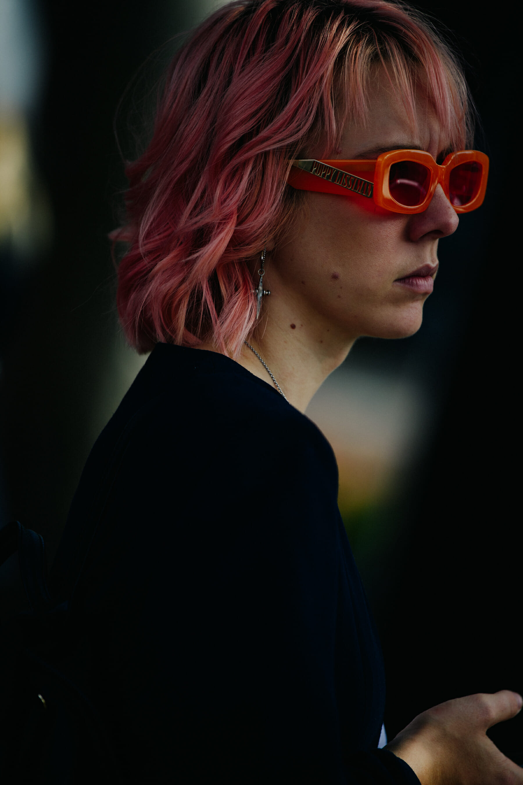 Woman wearing orange glasses