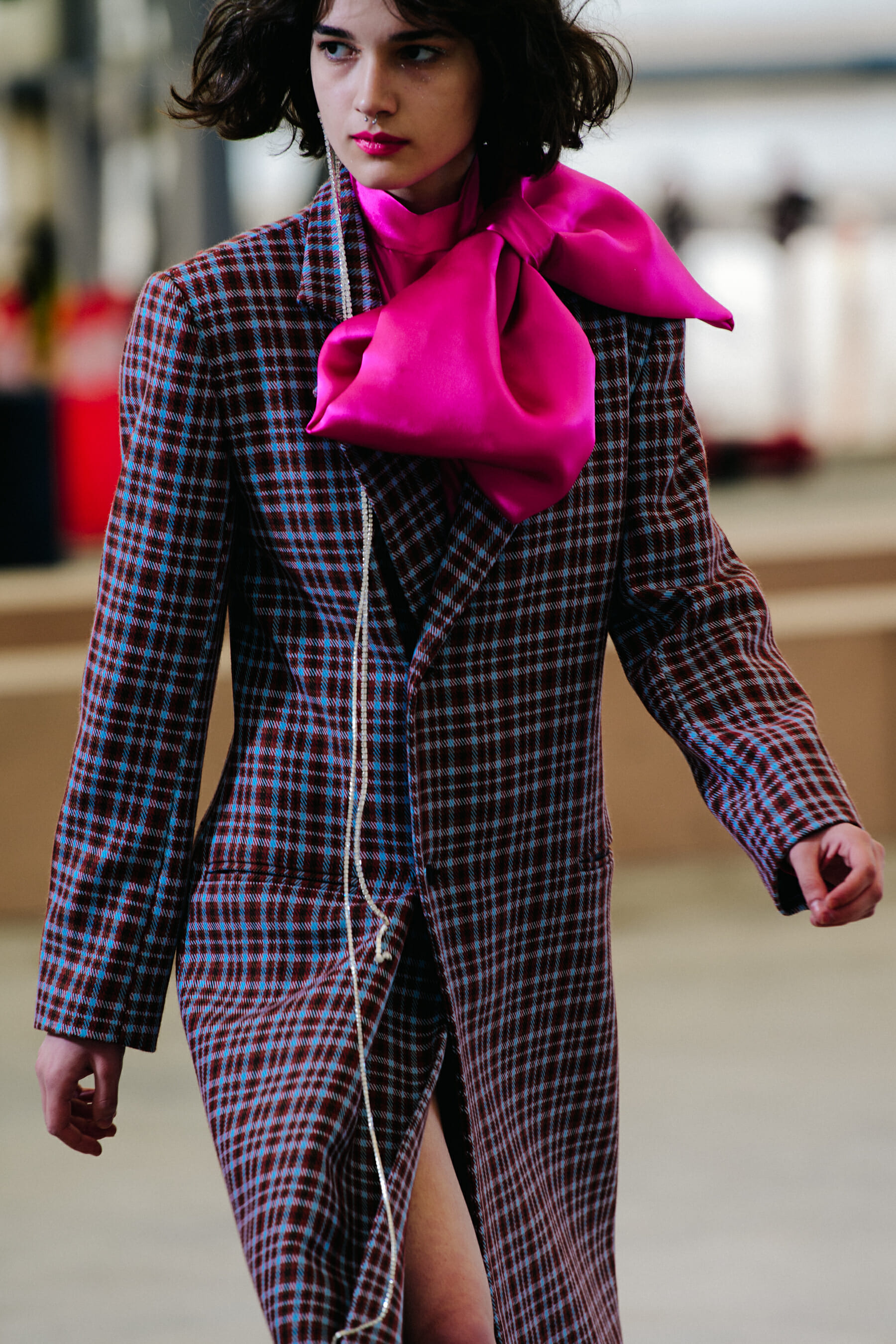Model wearing check coat