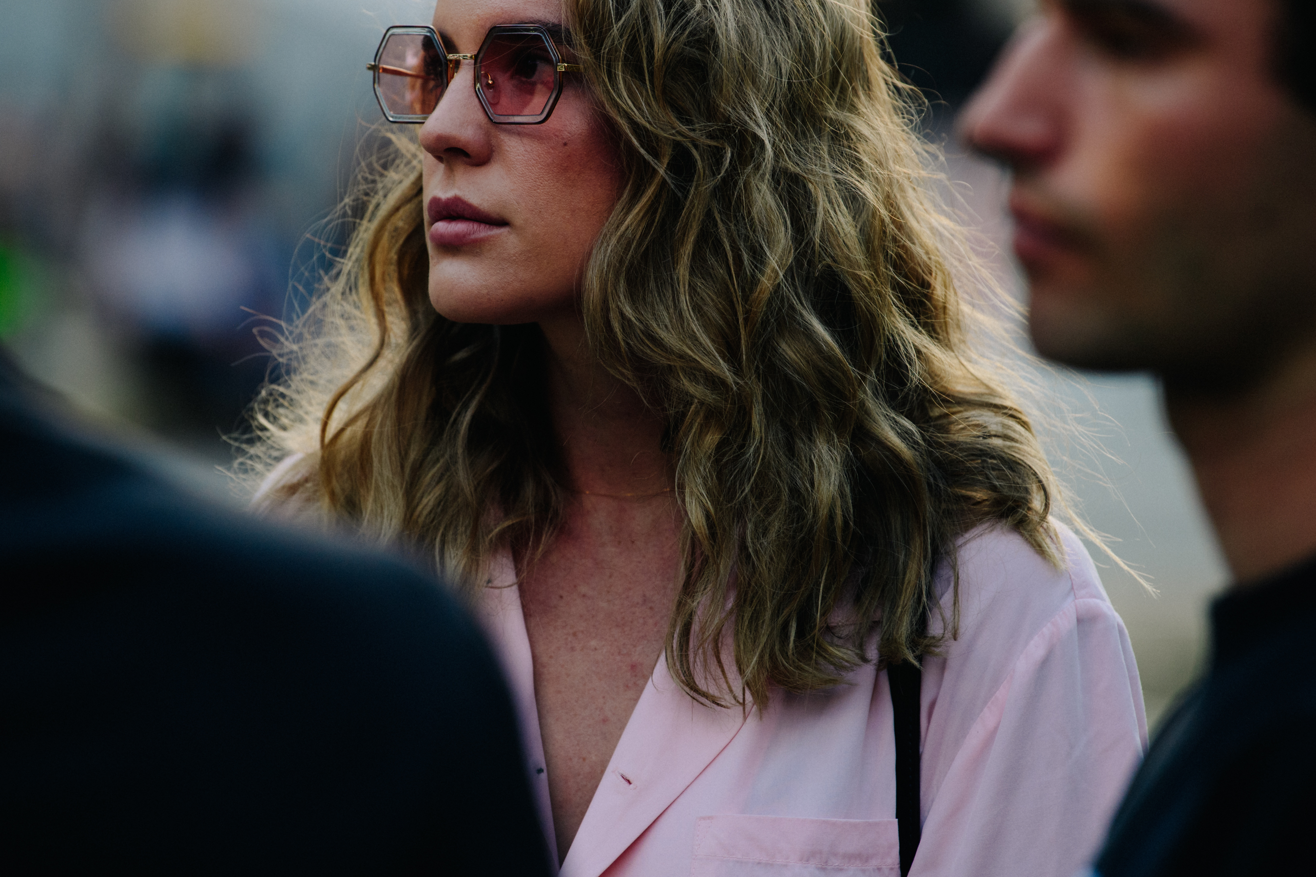 Woman wearing pink sunglasses