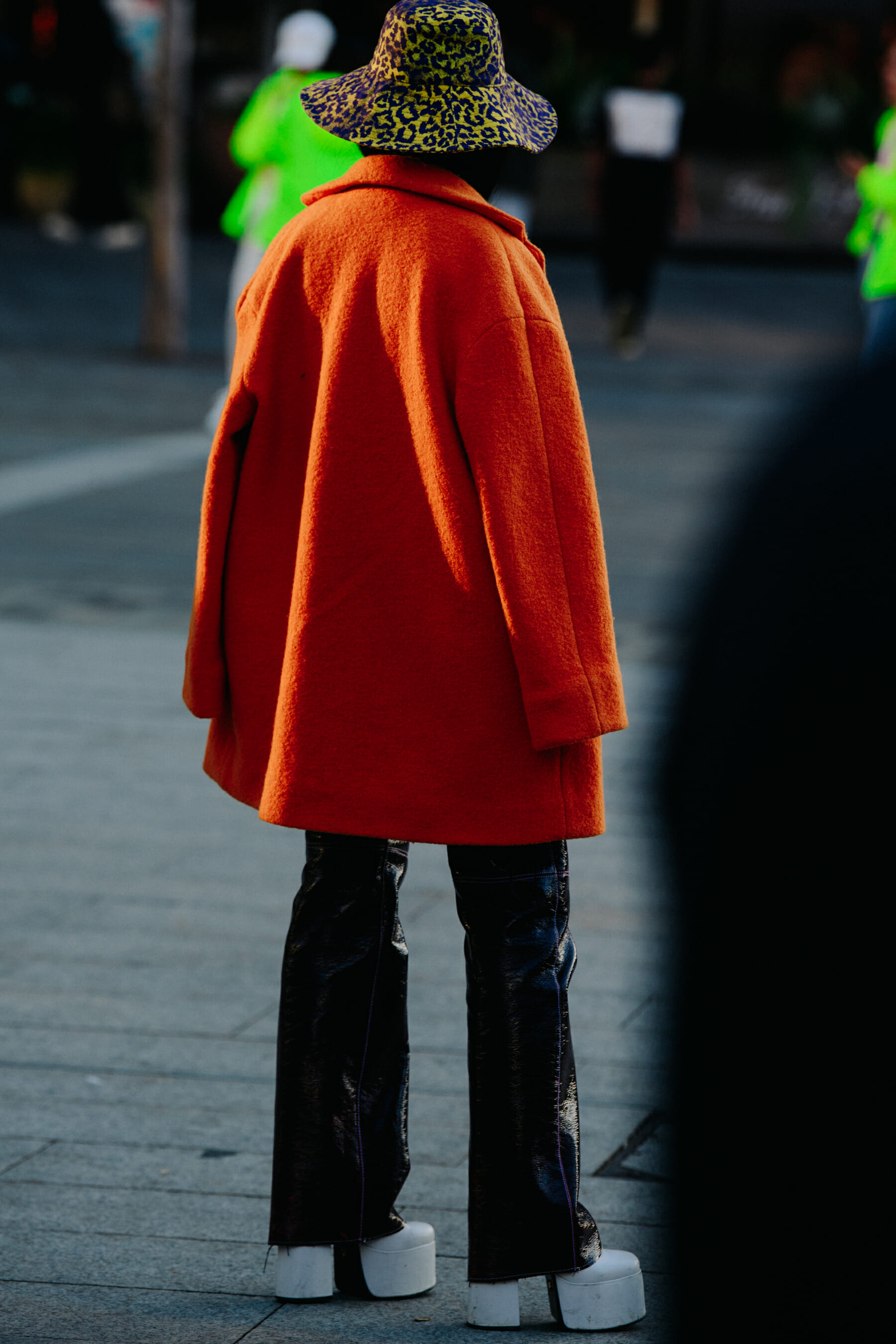 Woman wearing orange coat