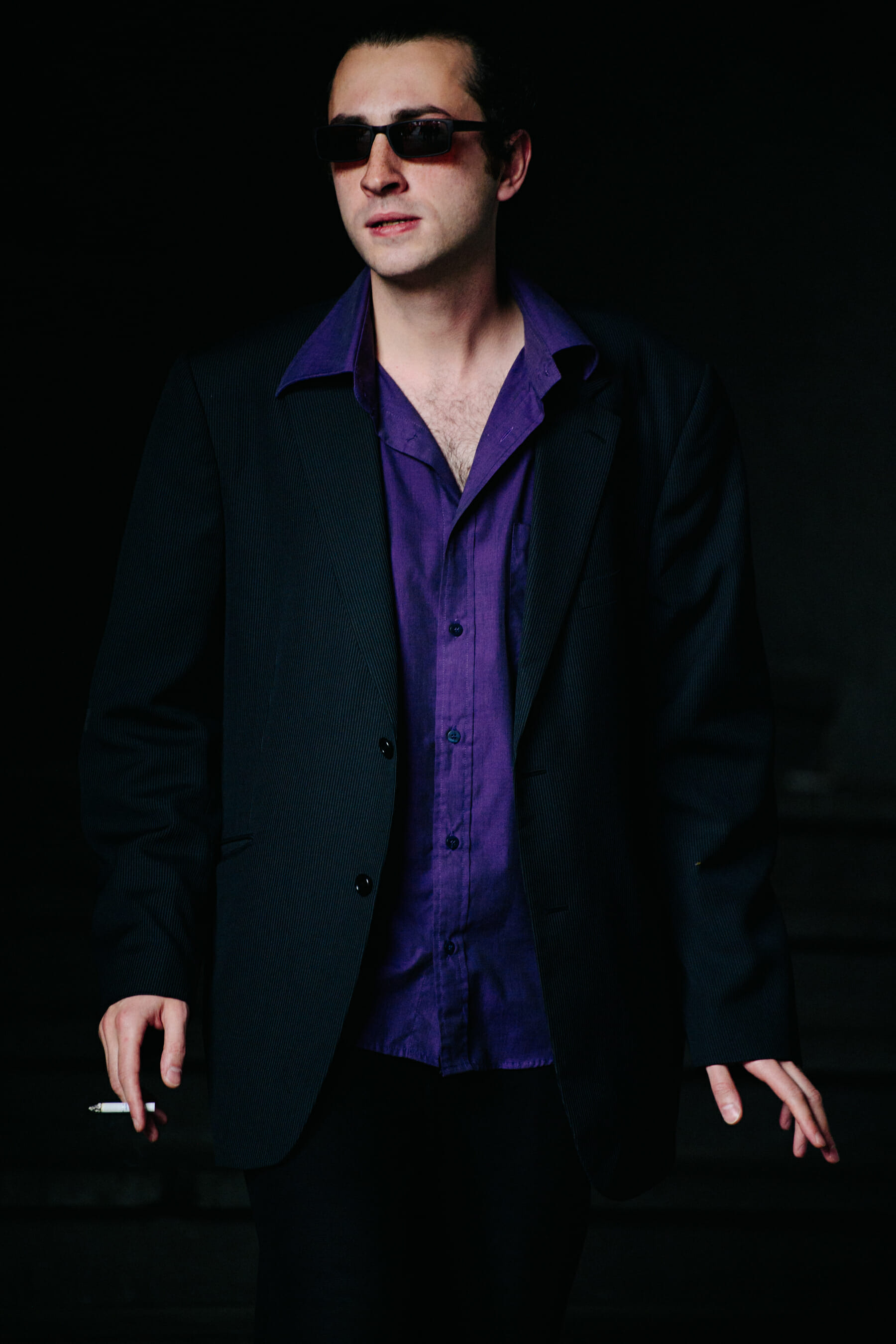 Man wearing purple shirt