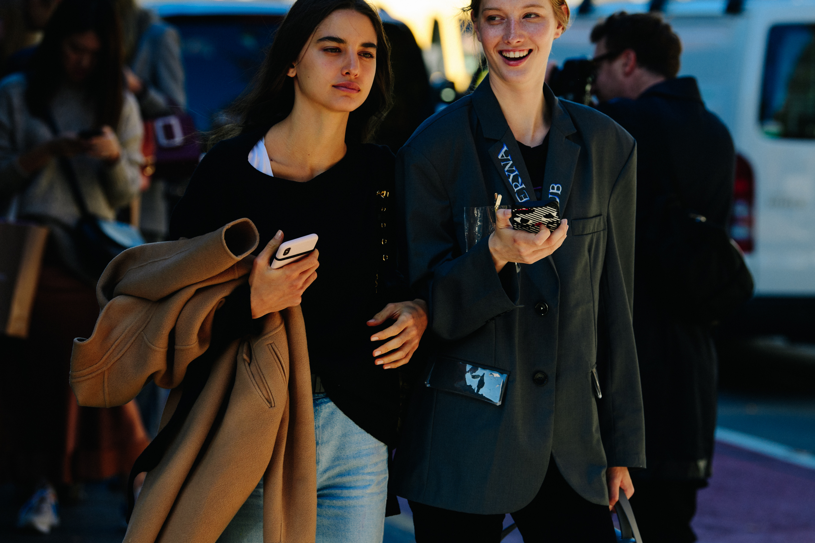 Two women wearing dark clothing