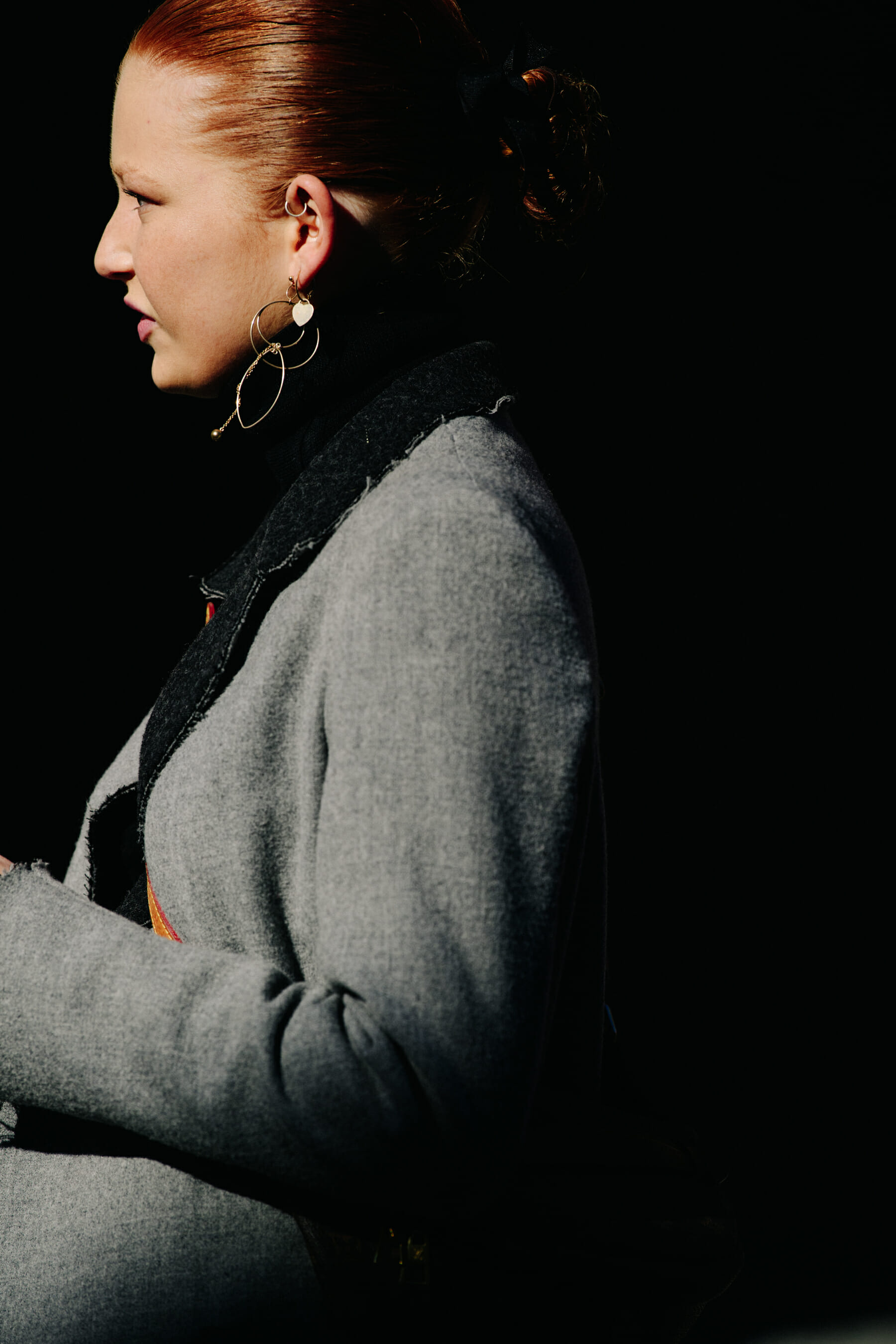 Woman wearing grey jacket