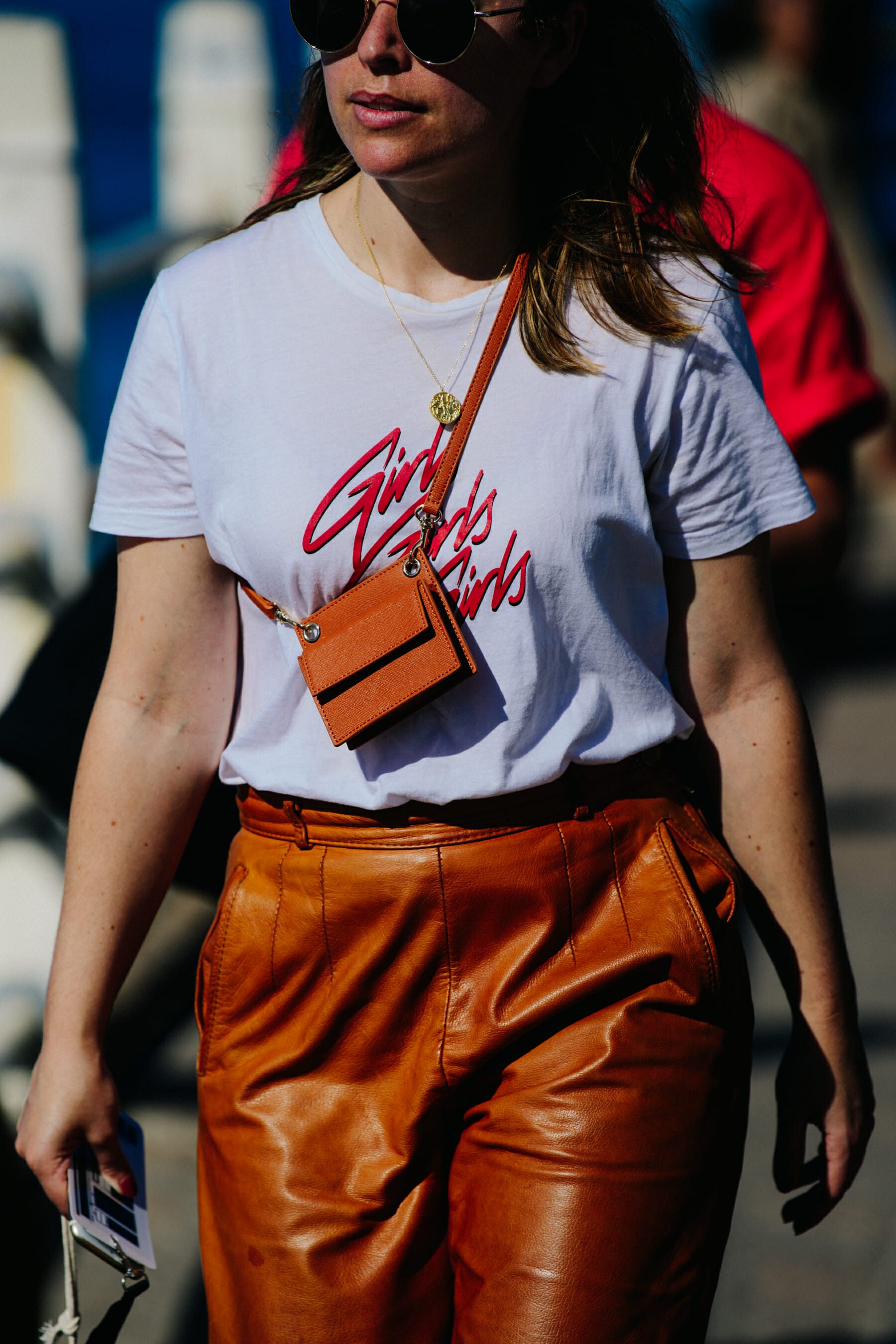 Woman wearing brown leather pants