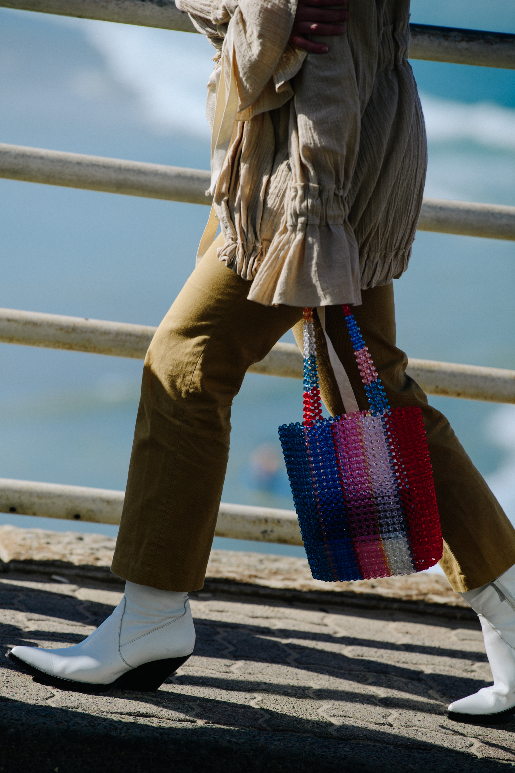 Woman carrying colourful bag