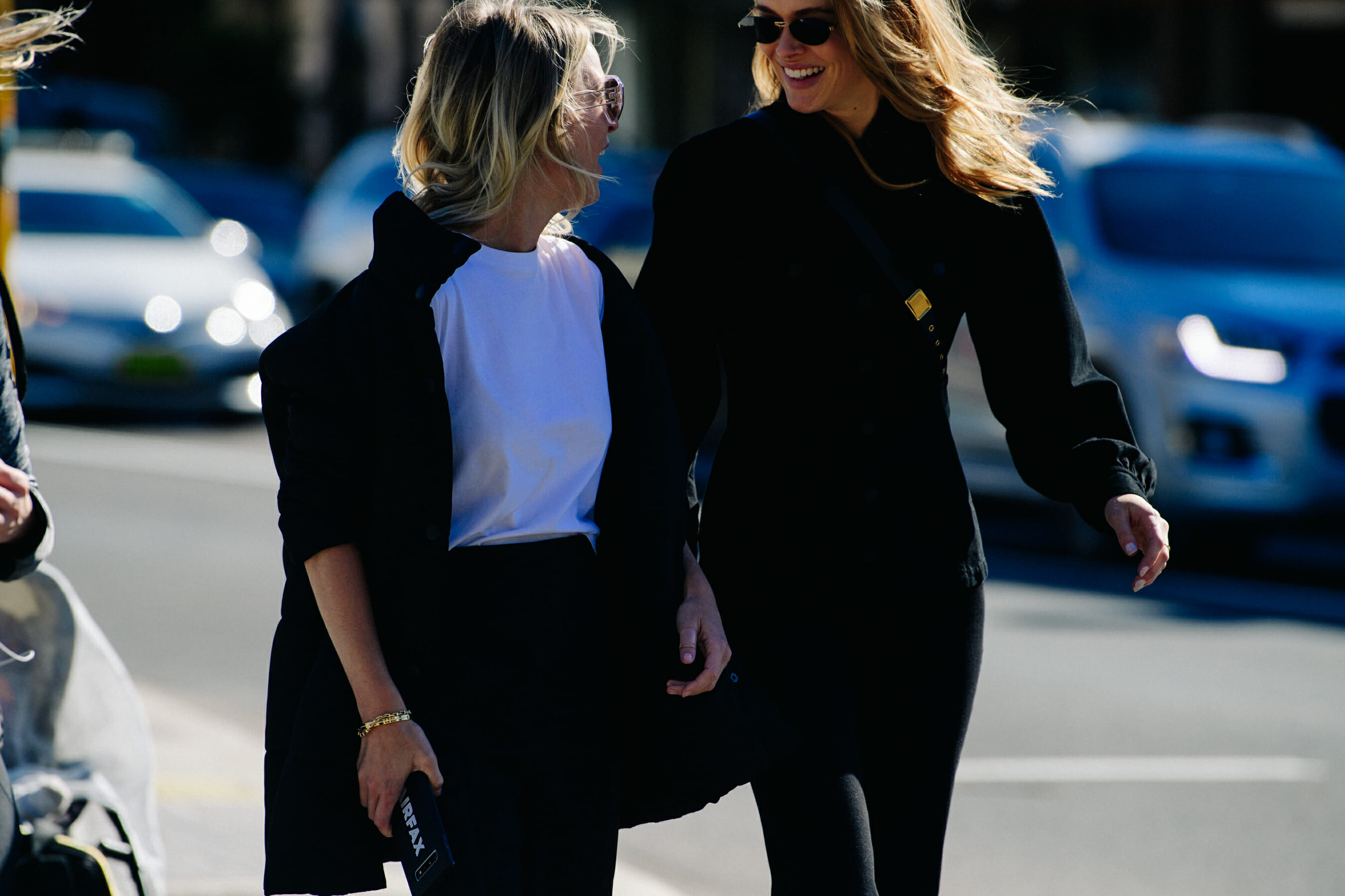Two women wearing black