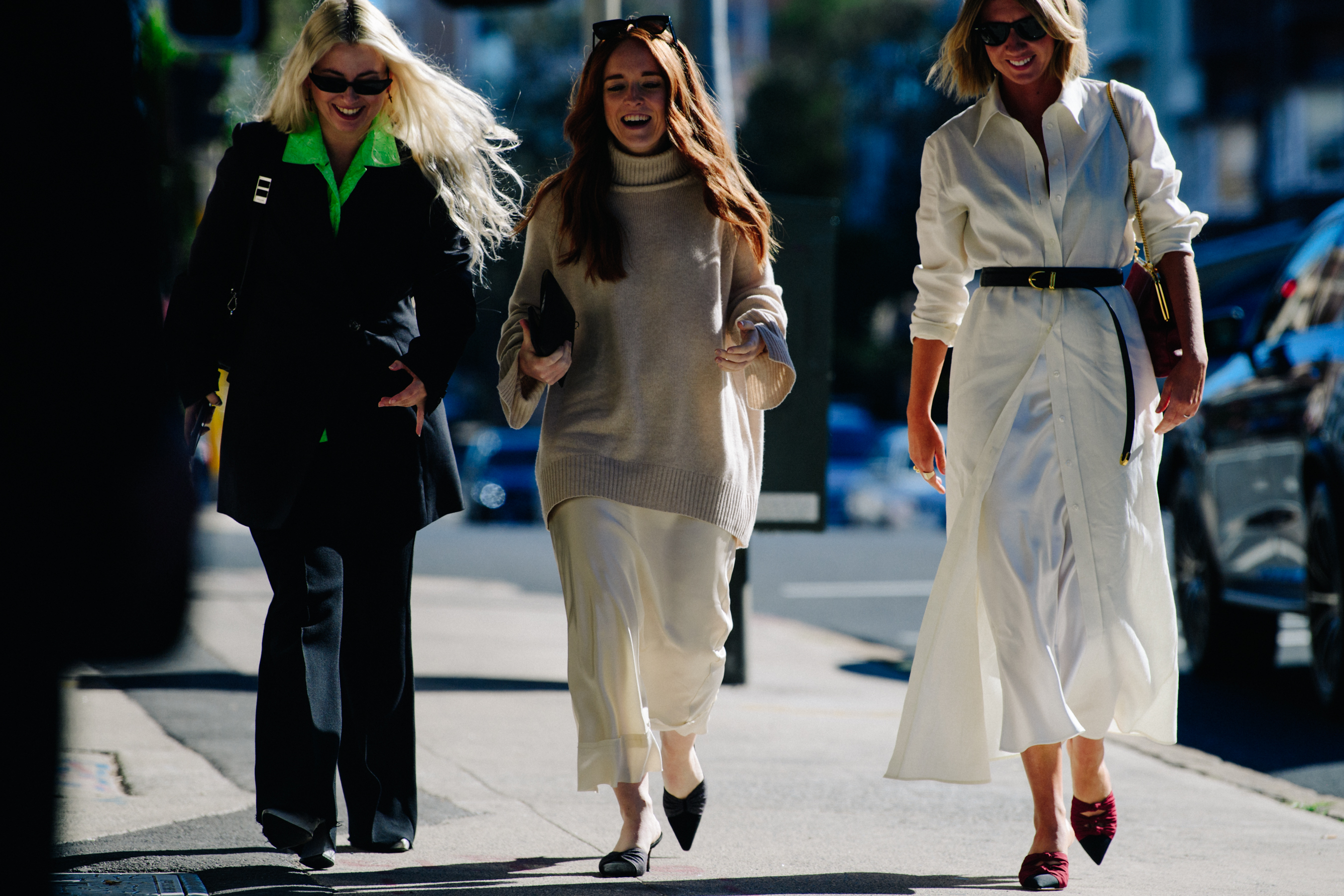 Three women wearing stylish outfits