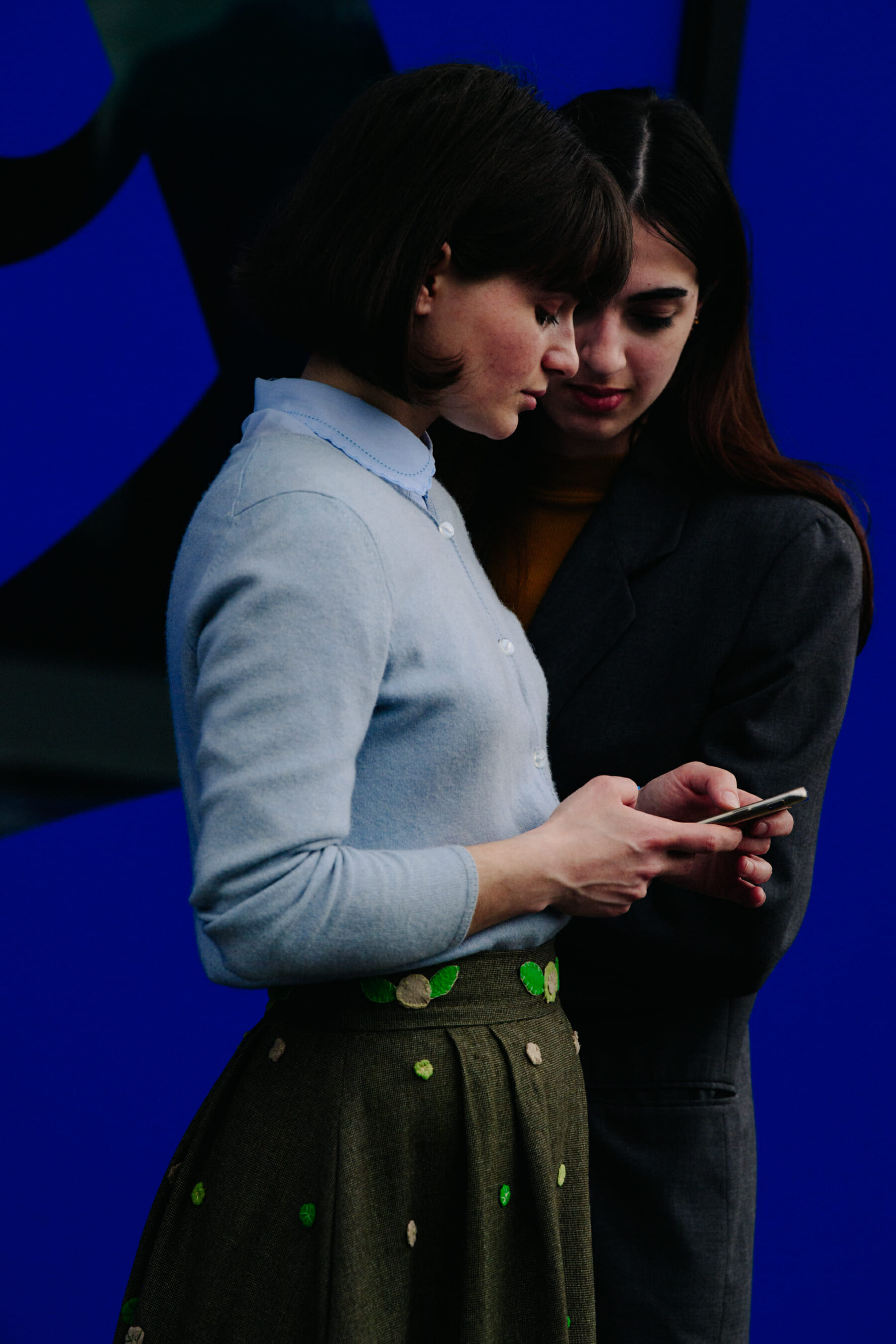 Two women wearing wool outfits