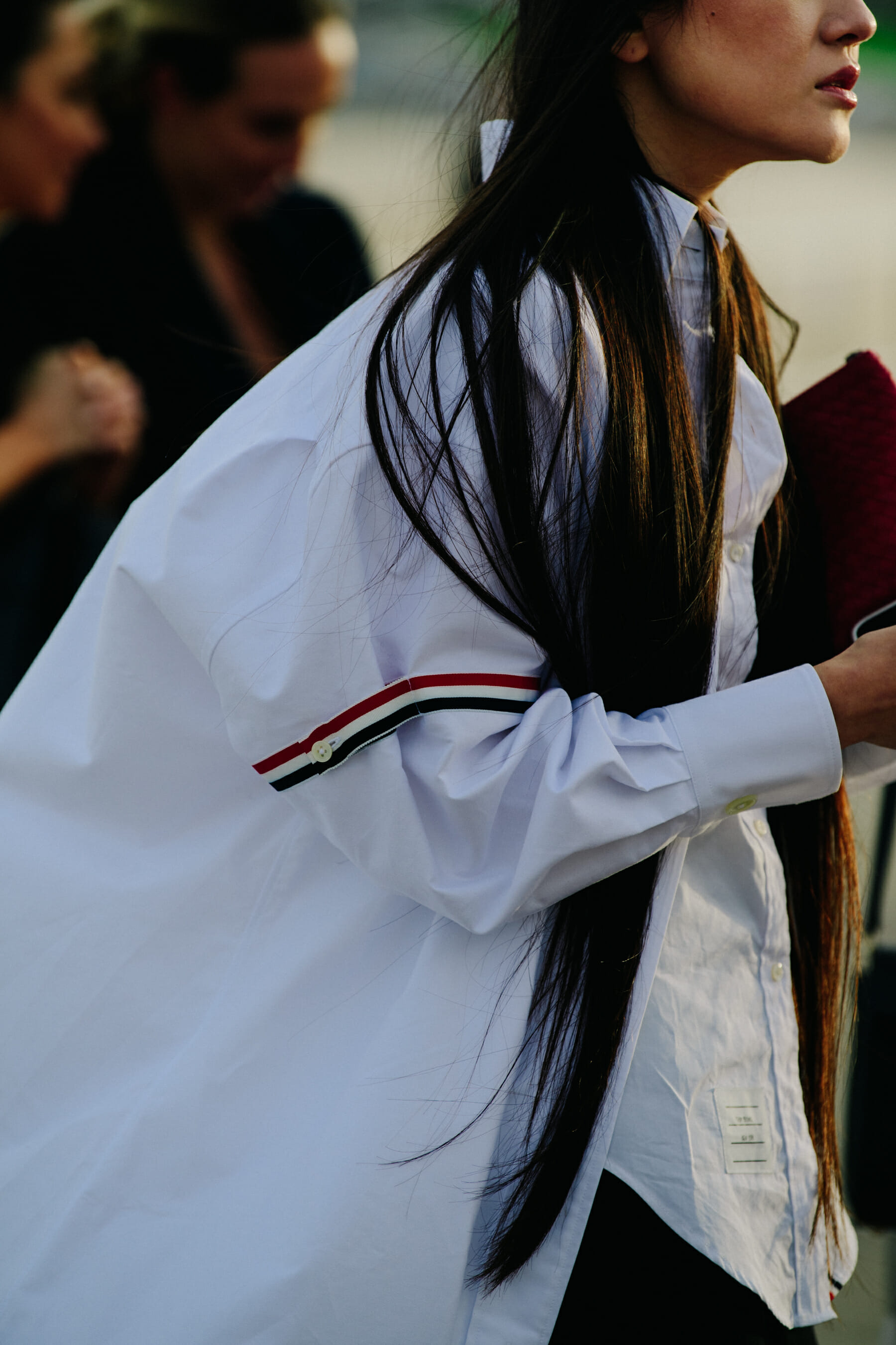 Woman wearing Thom Browne shirt
