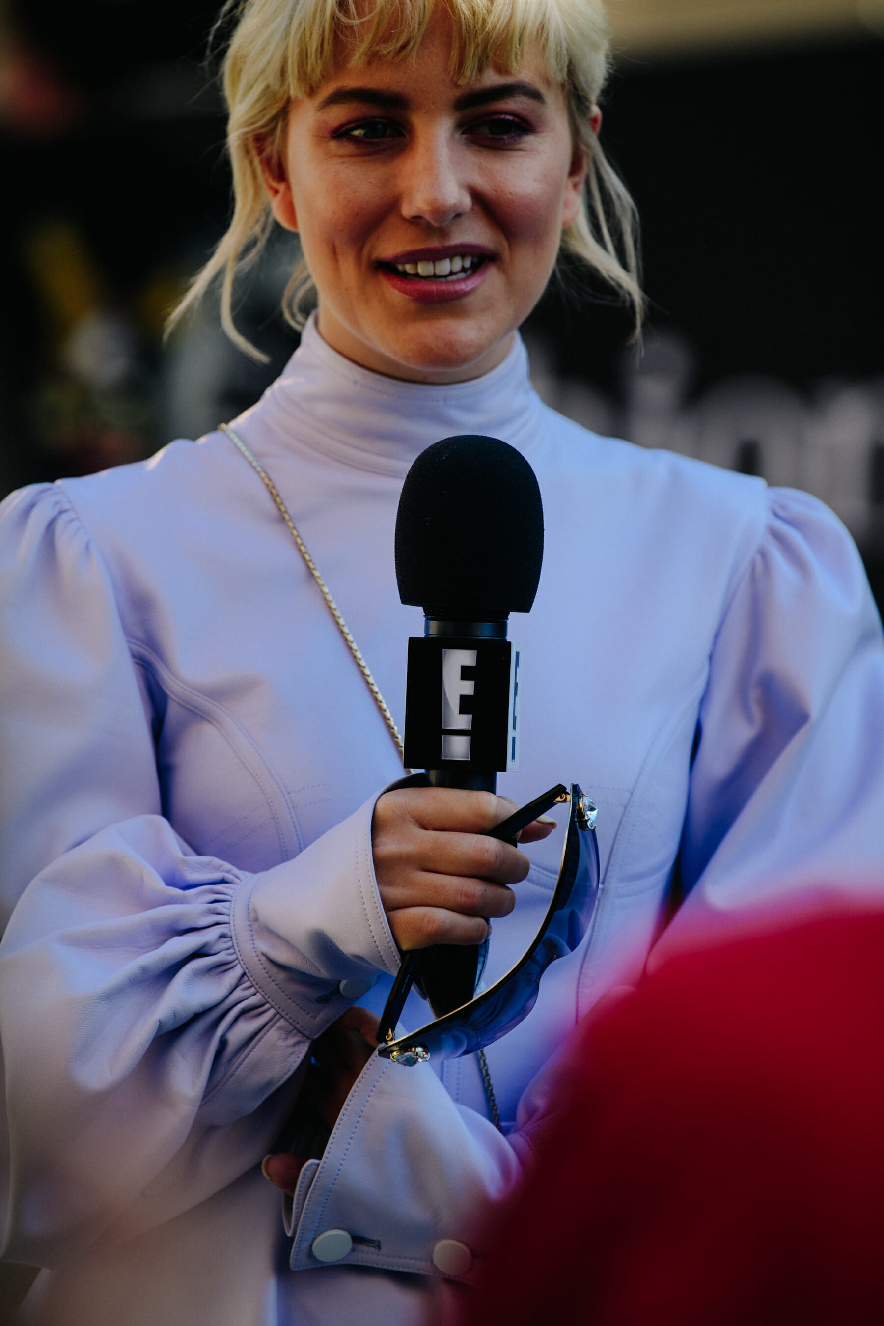Woman carrying microphone
