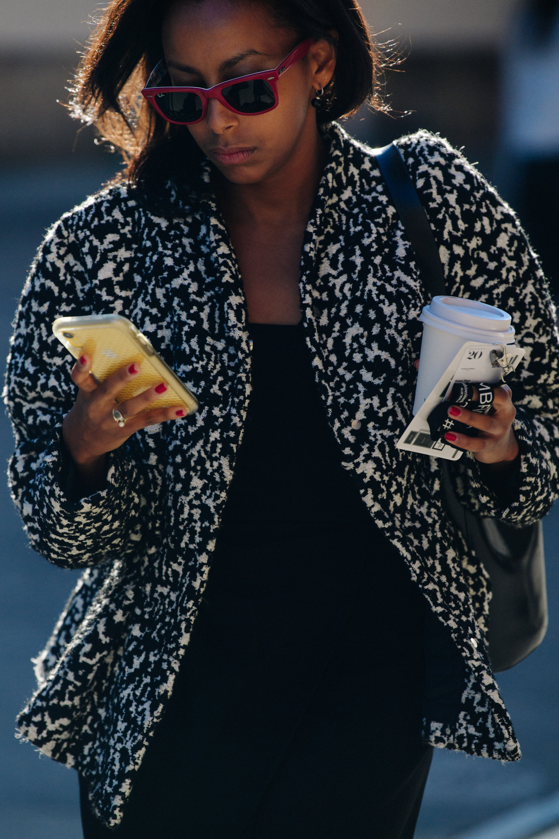 Woman wearing red sunglasses