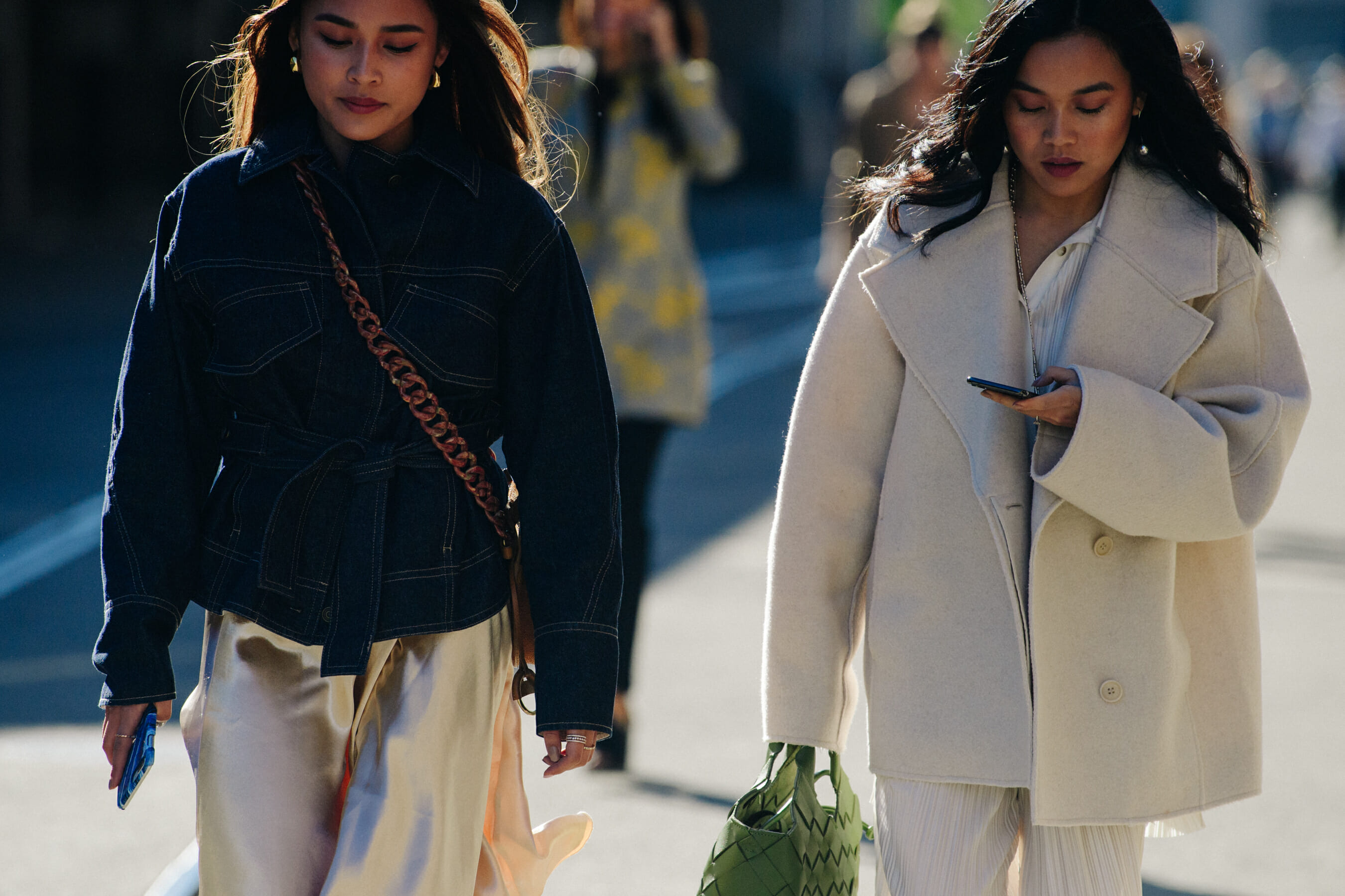 Two women wearing thick jackets