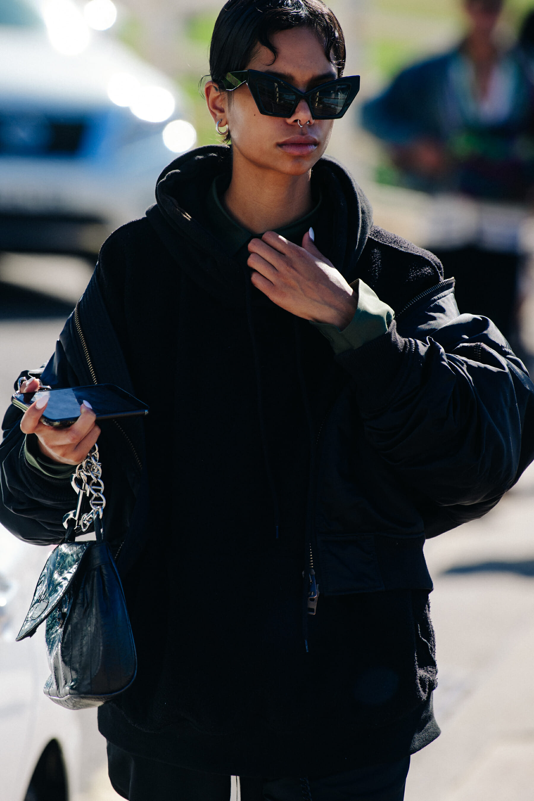 Woman wearing large black sunglasses