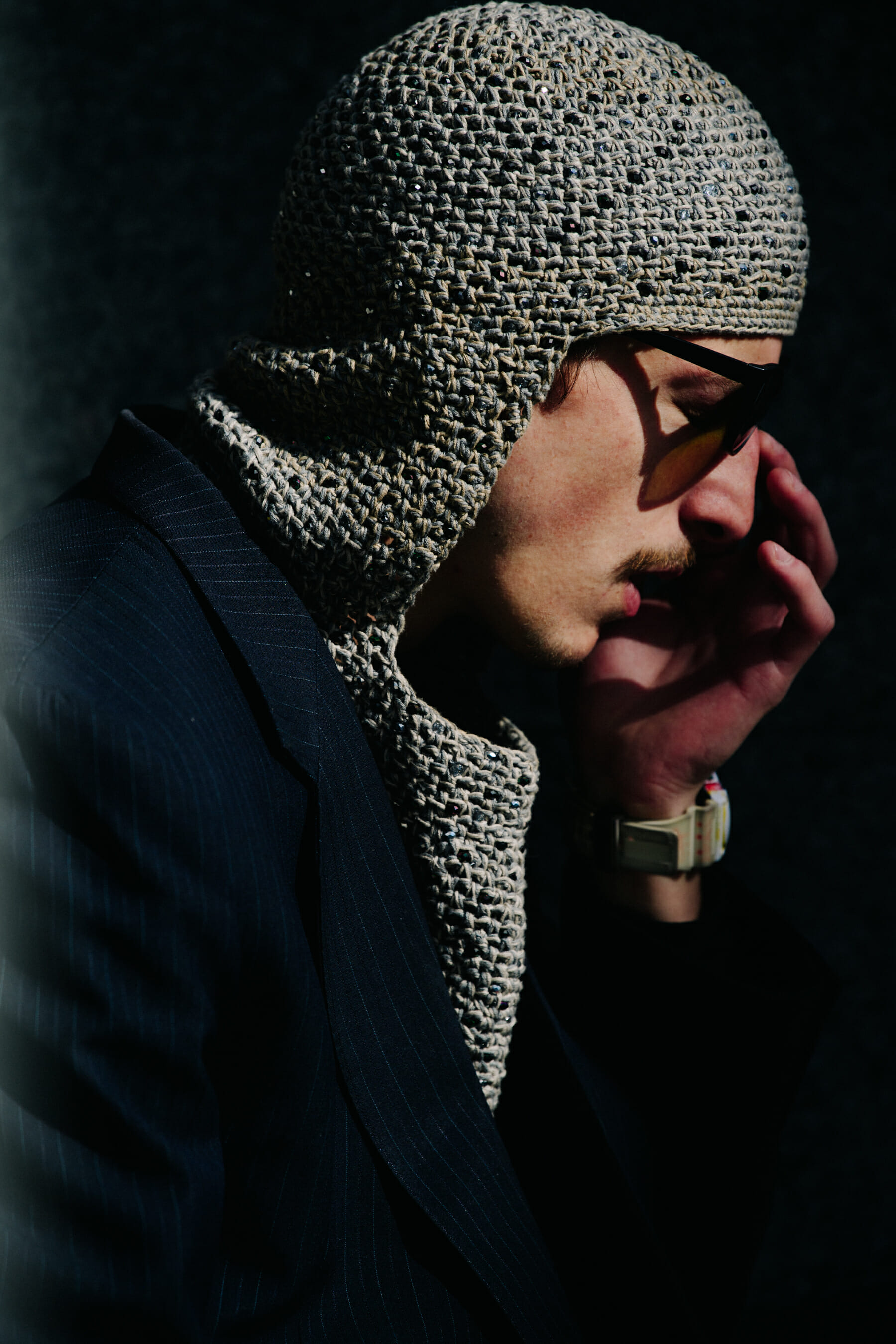 Man wearing knitted headpiece