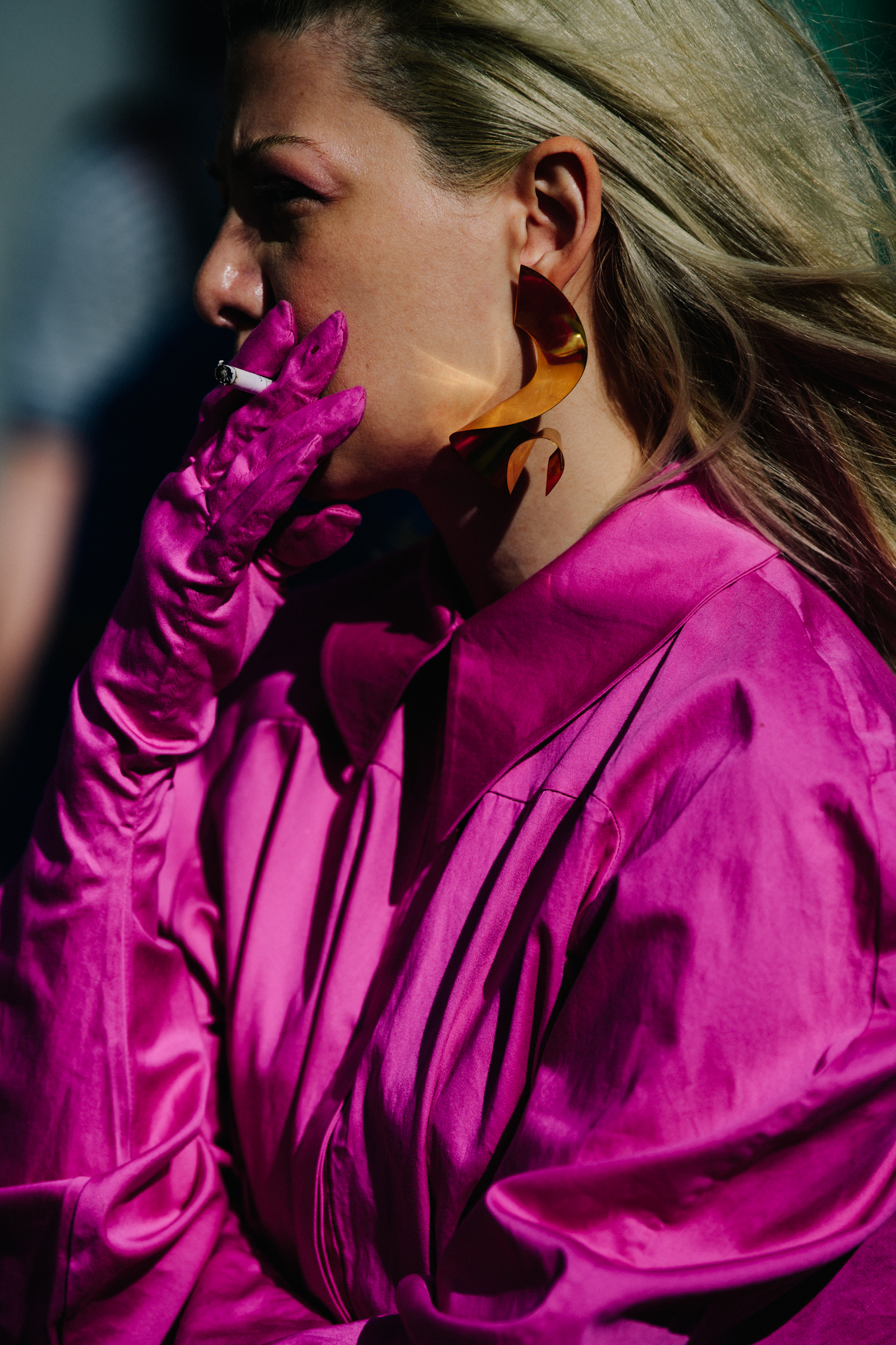 Woman wearing pink dress and gloves