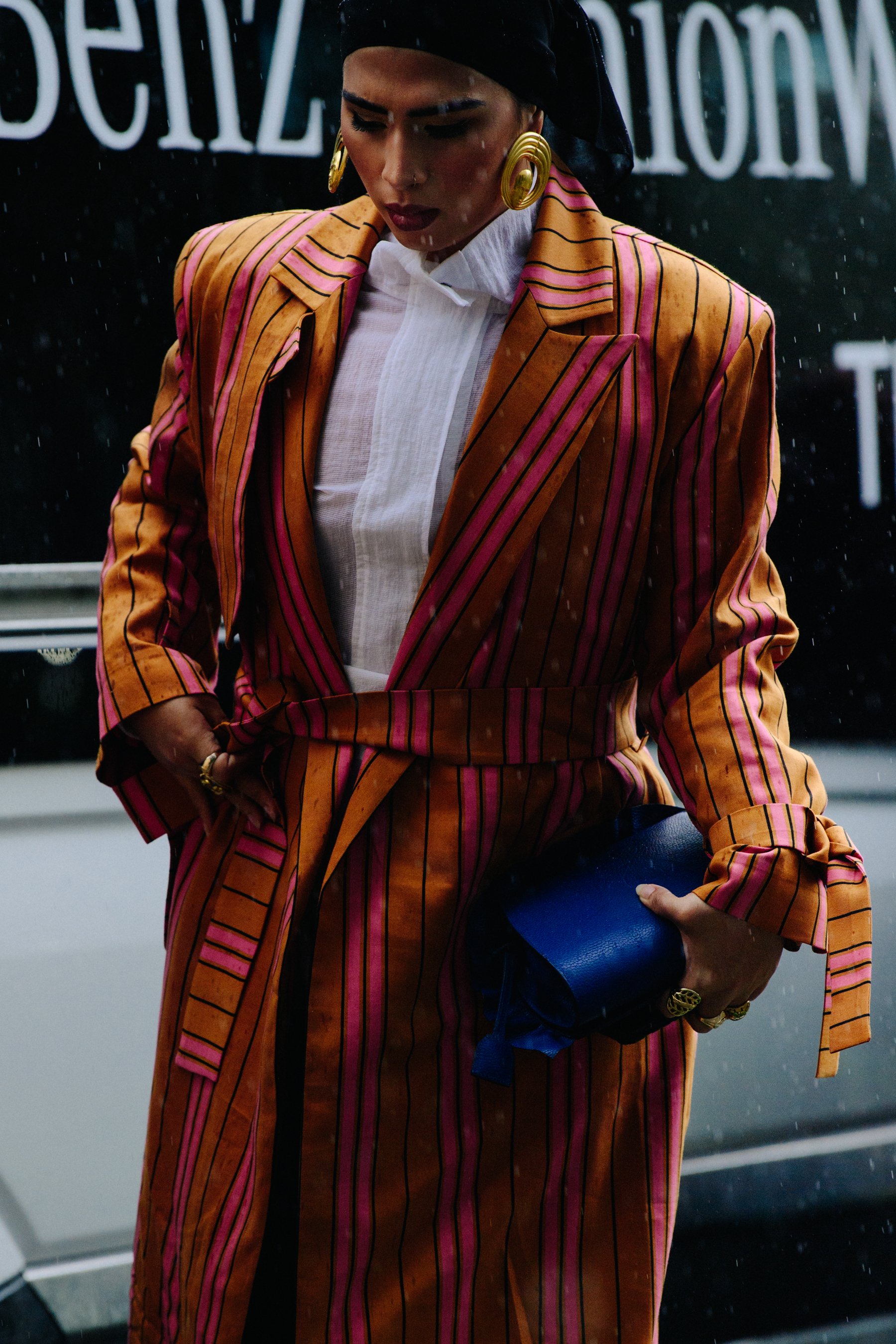 Woman wearing colourful striped coat
