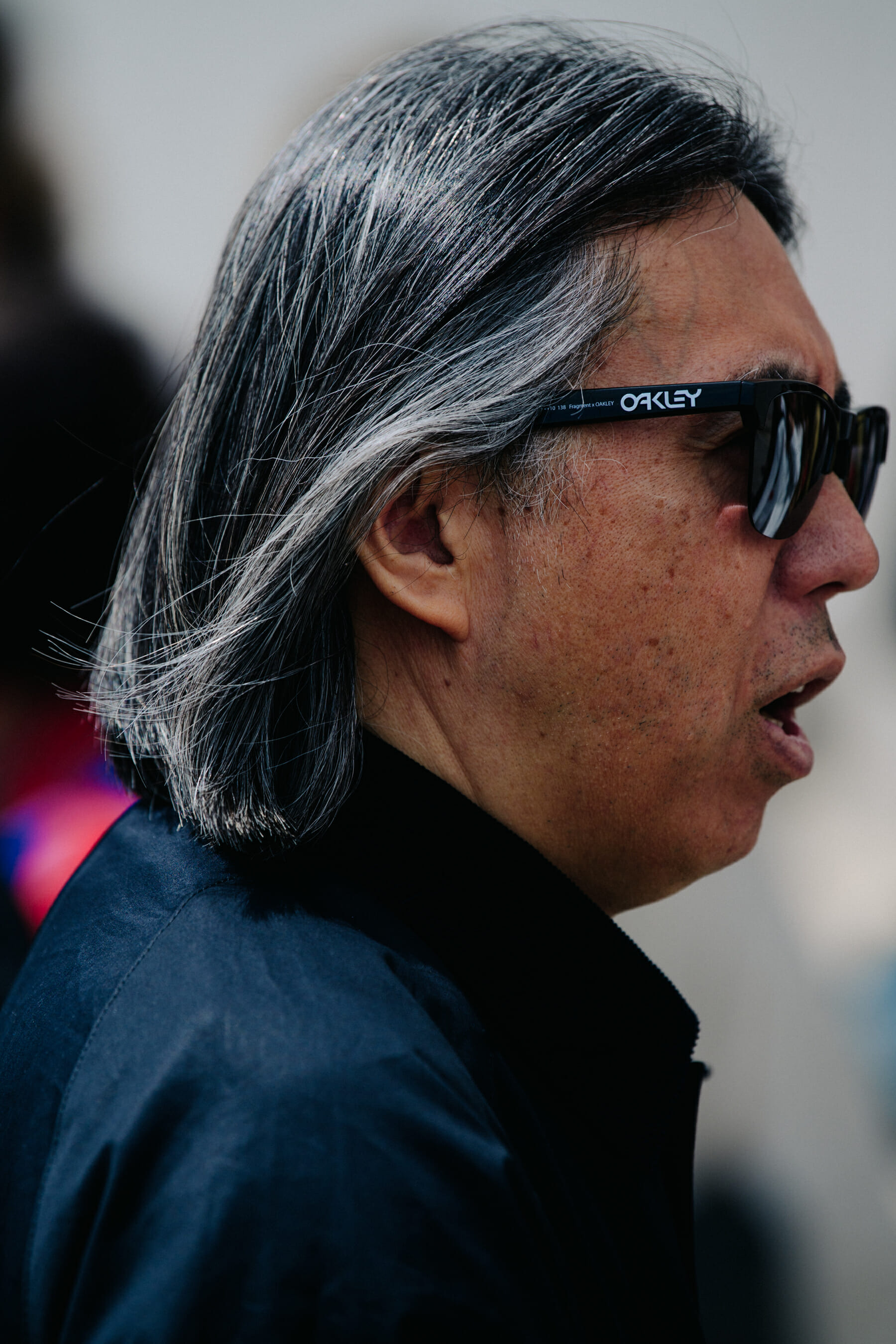 Japanese designer wearing Oakley sunglasses
