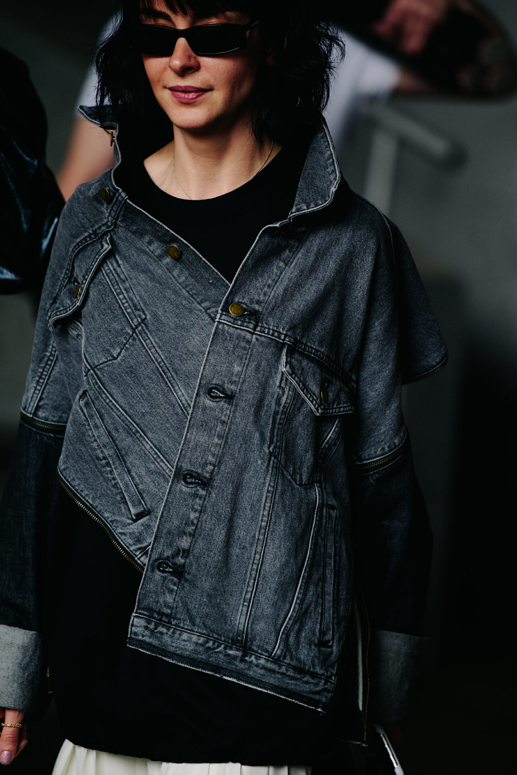 Woman wearing grey denim jacket