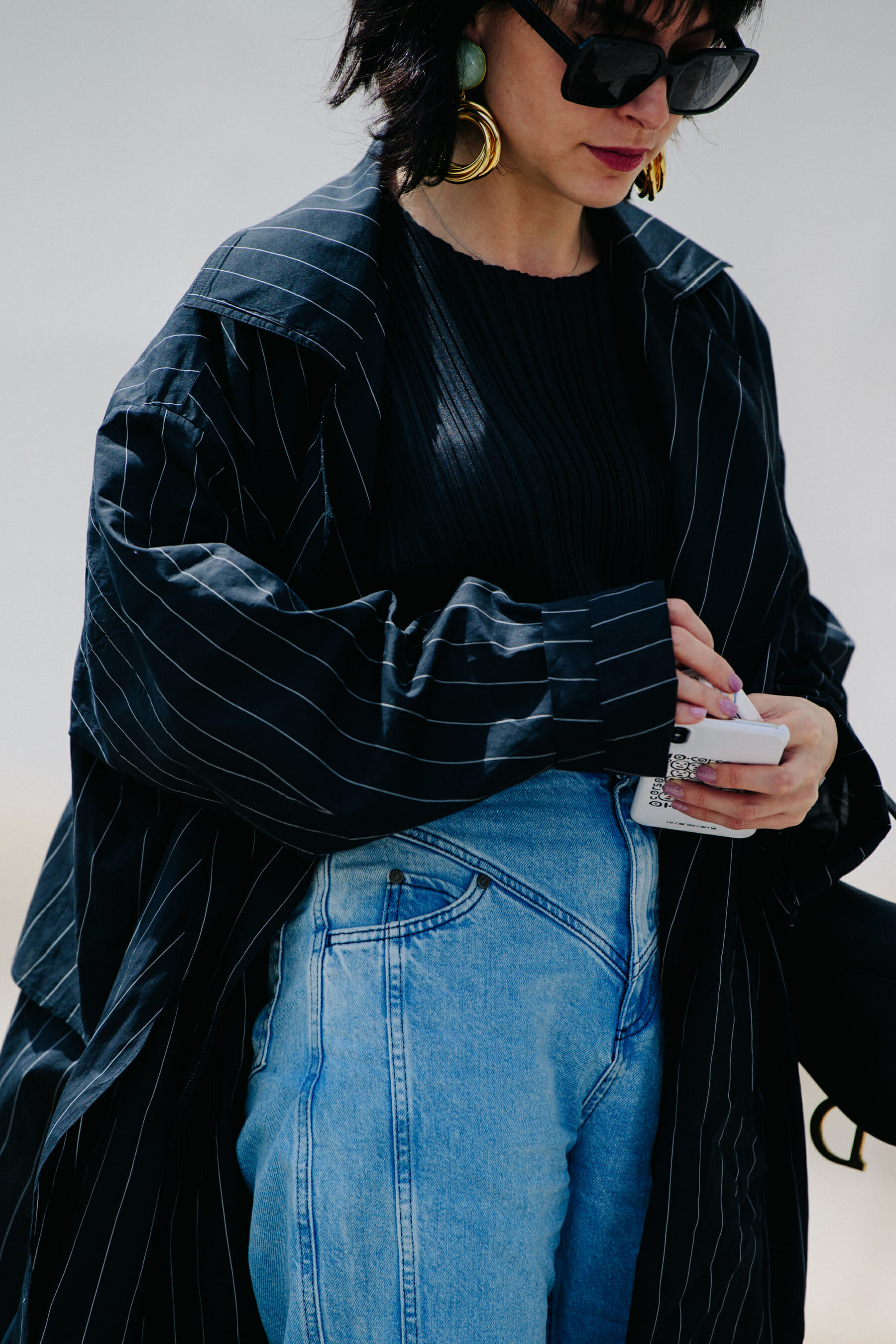 Woman wearing striped coat