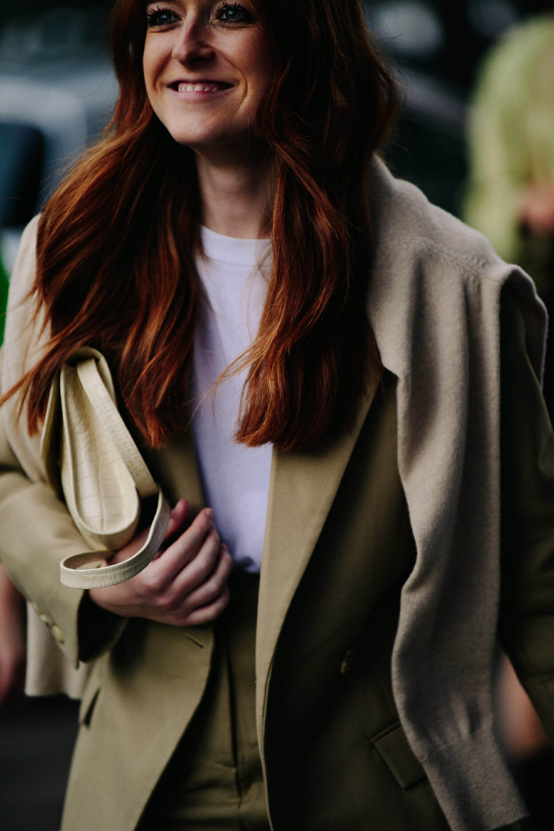 Woman wearing tan coat