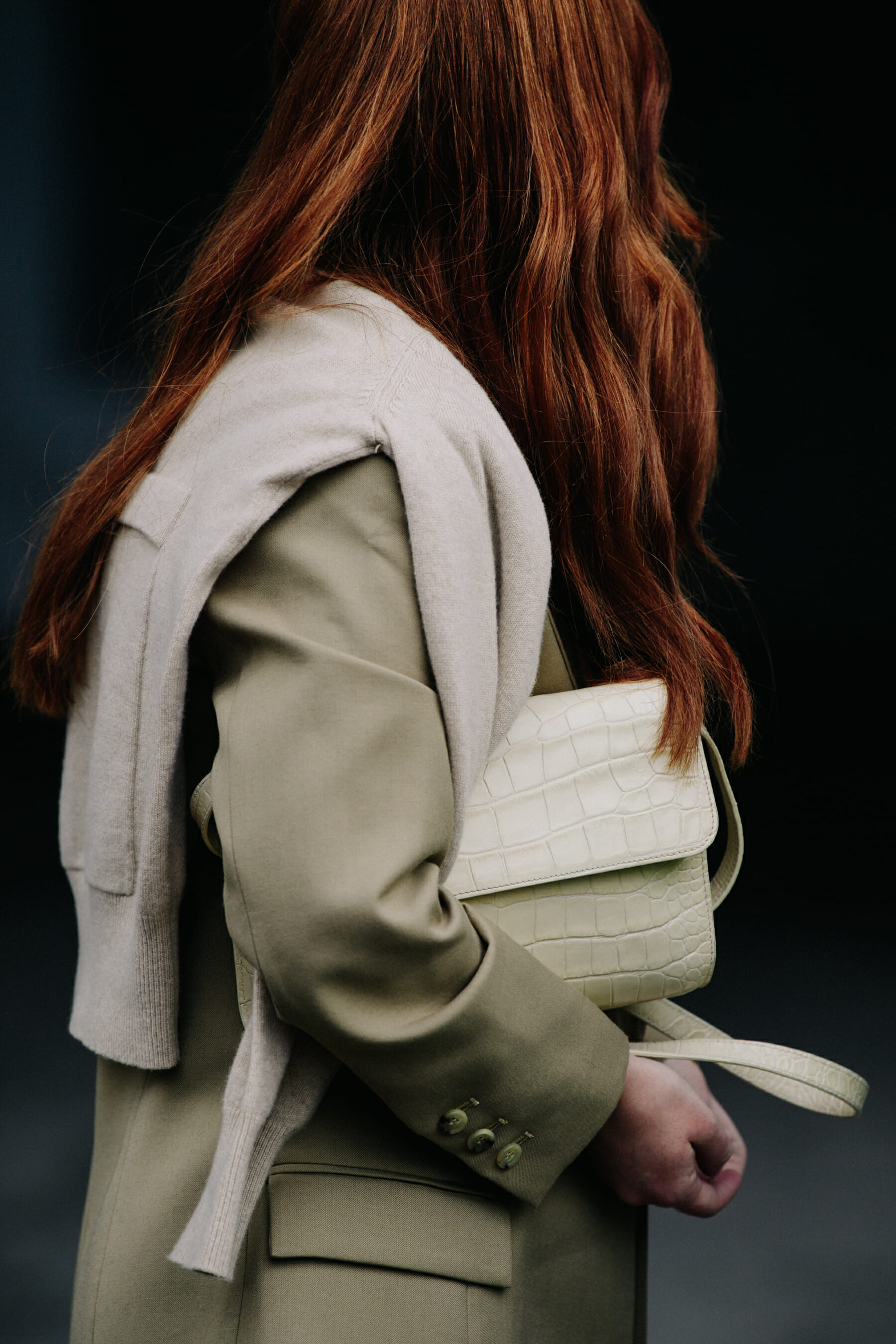 Woman wearing tan coat
