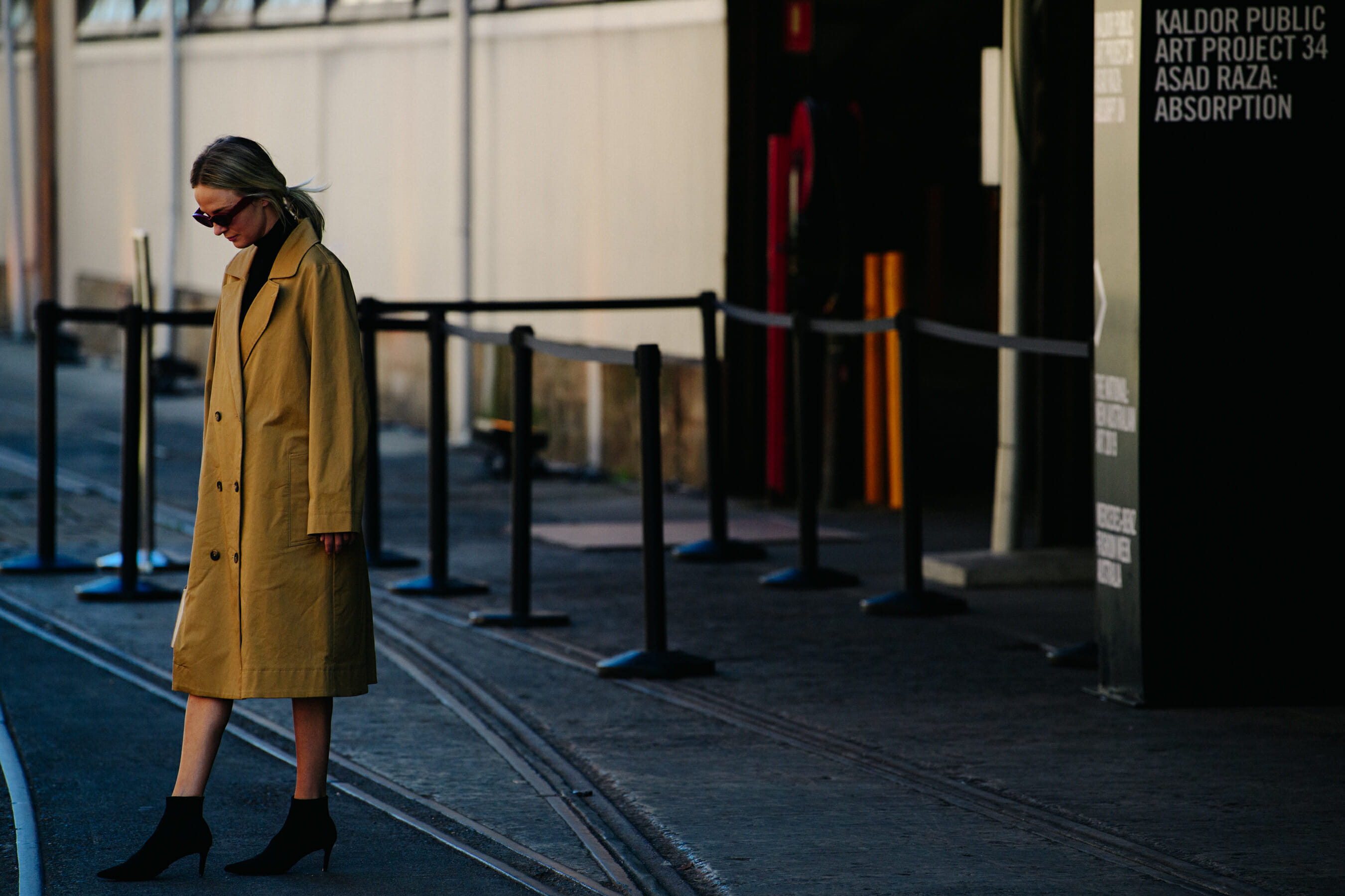 Woman wearing tan coat