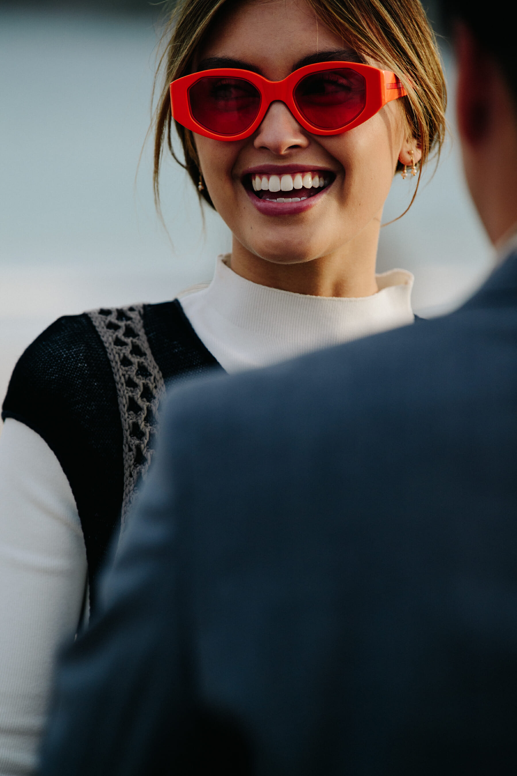 Woman wearing orange sunglasses