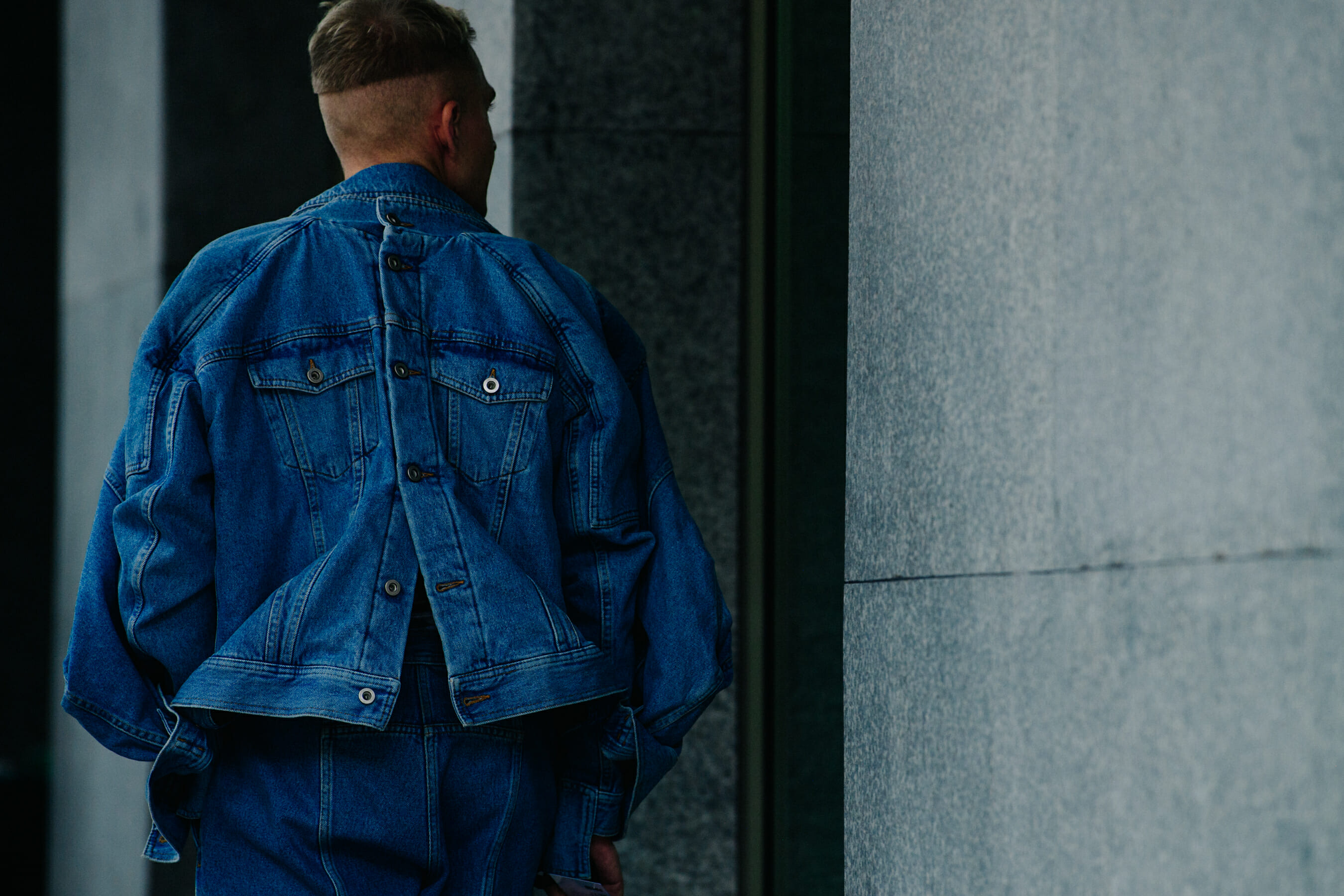 Stylist wearing denim jacket