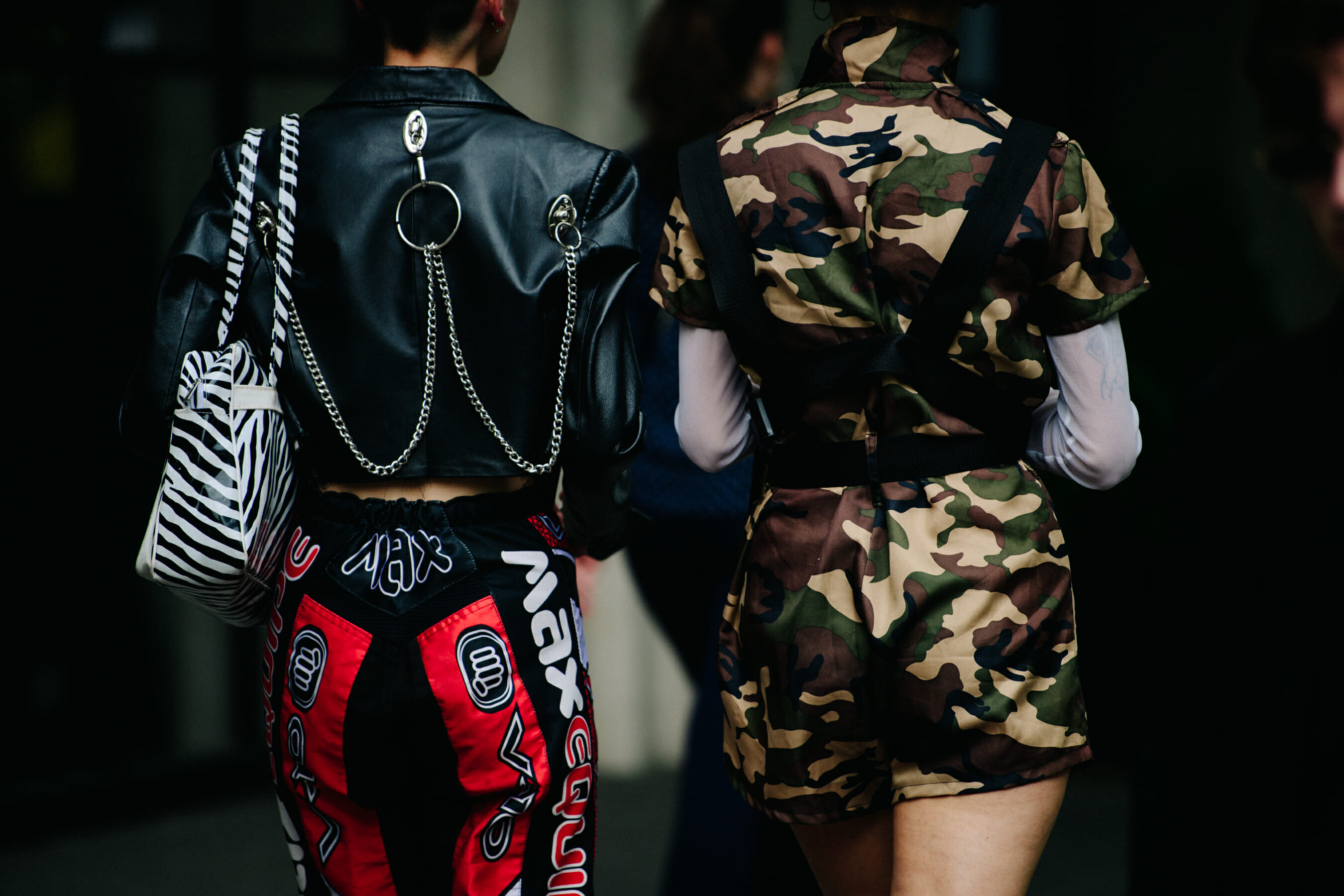 Two women wearing pattern clothing