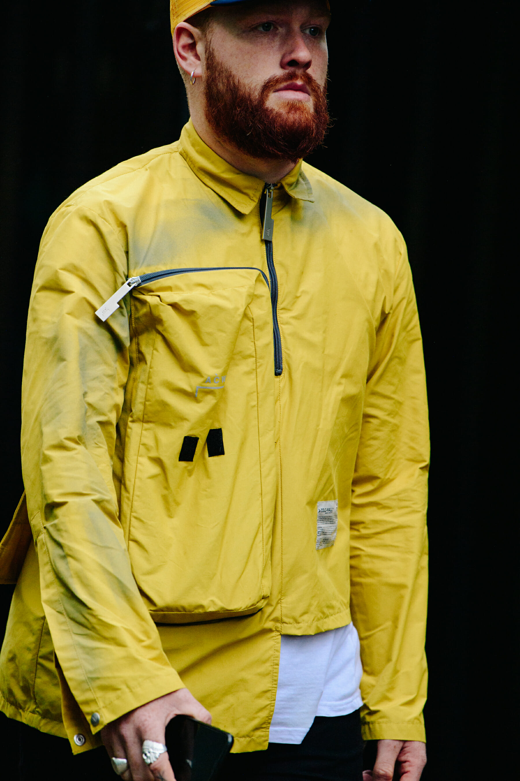 Man wearing yellow jacket