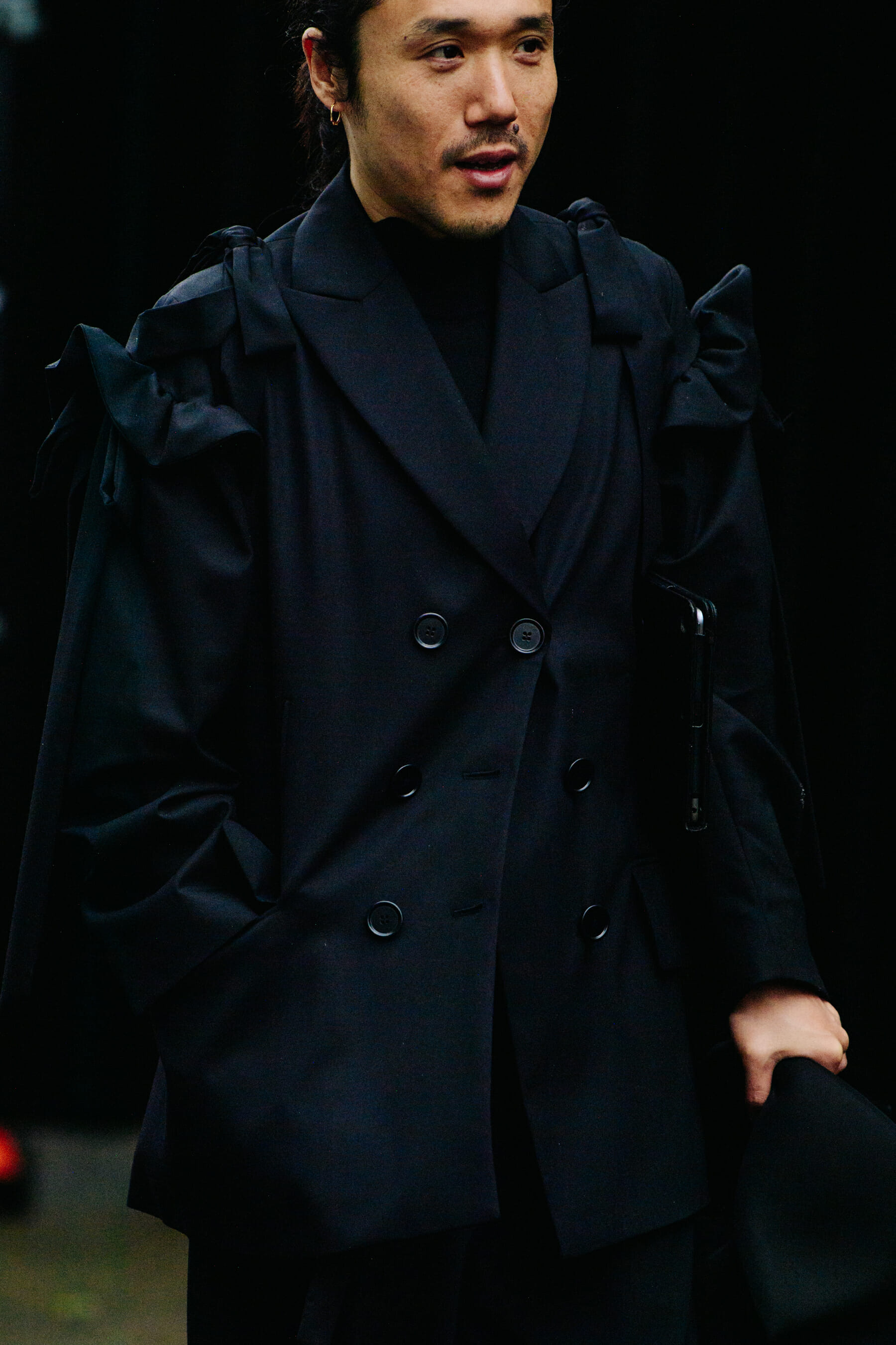 Man wearing black coat