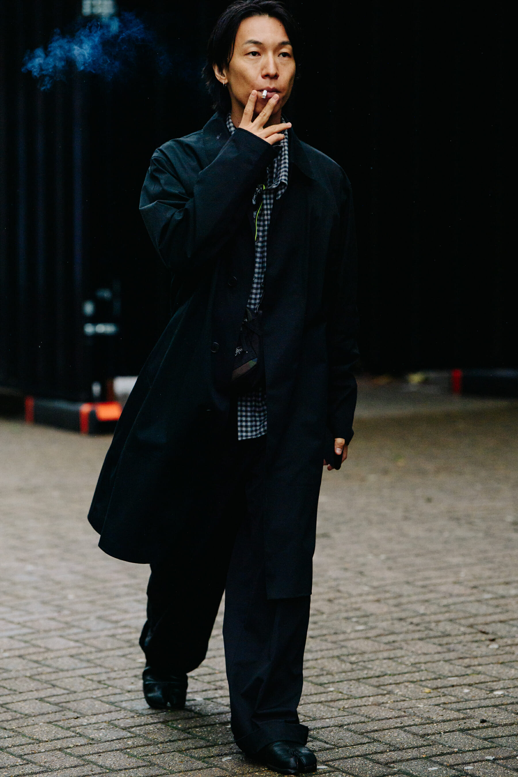 Man wearing black coat