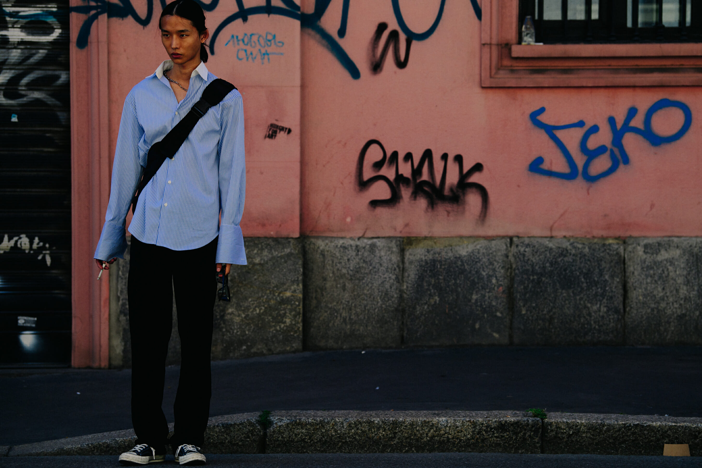 Model wearing blue striped shirt