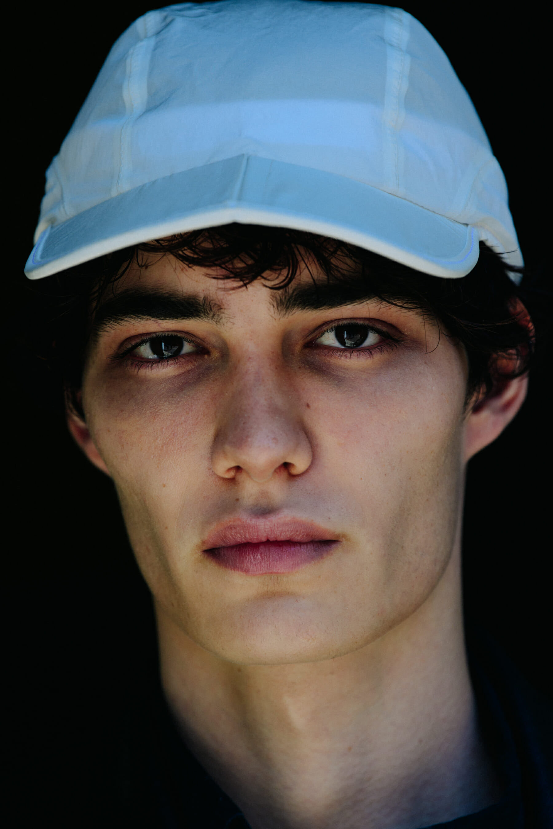 Portrait of model with thick dark hair