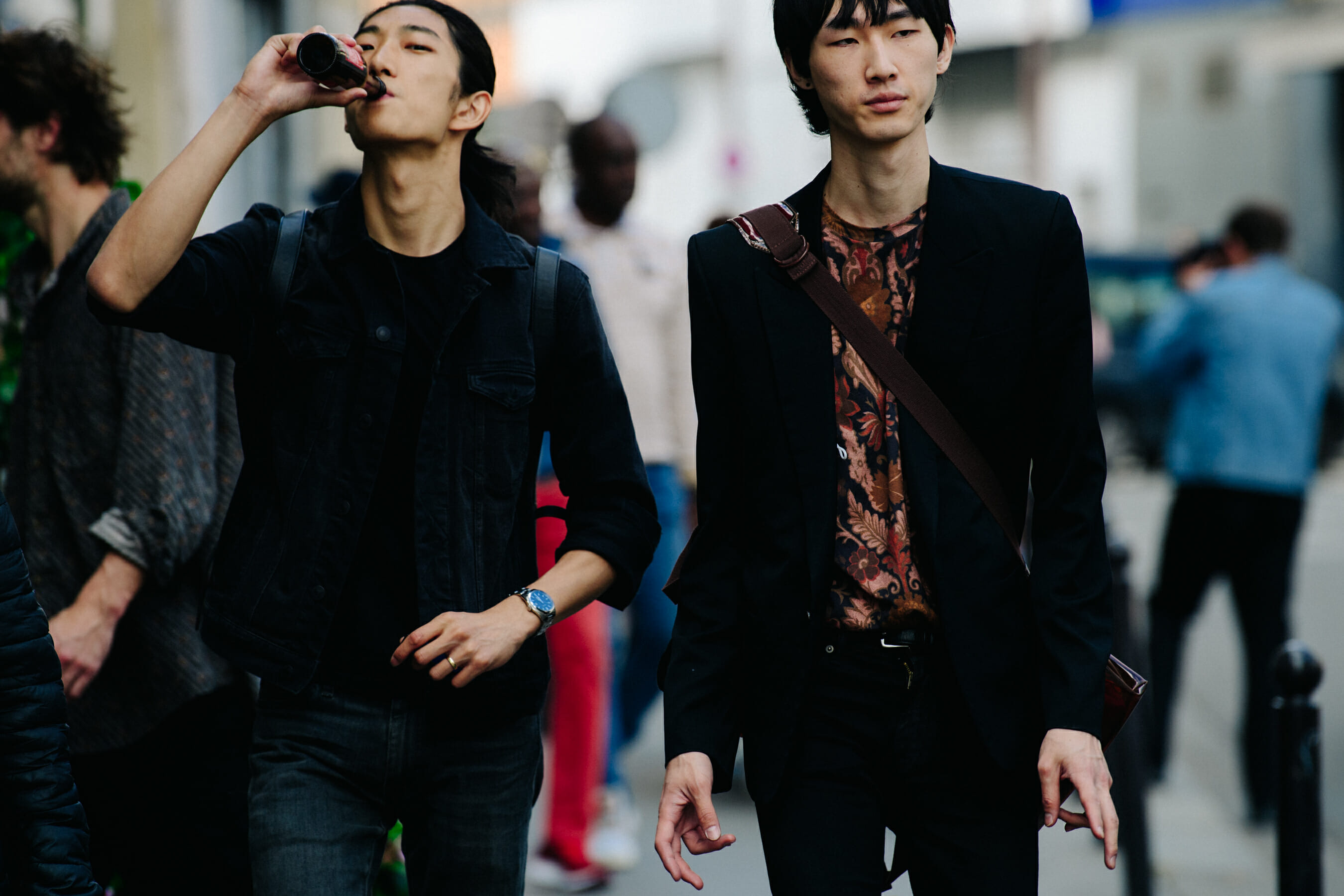 Two models wearing black jackets