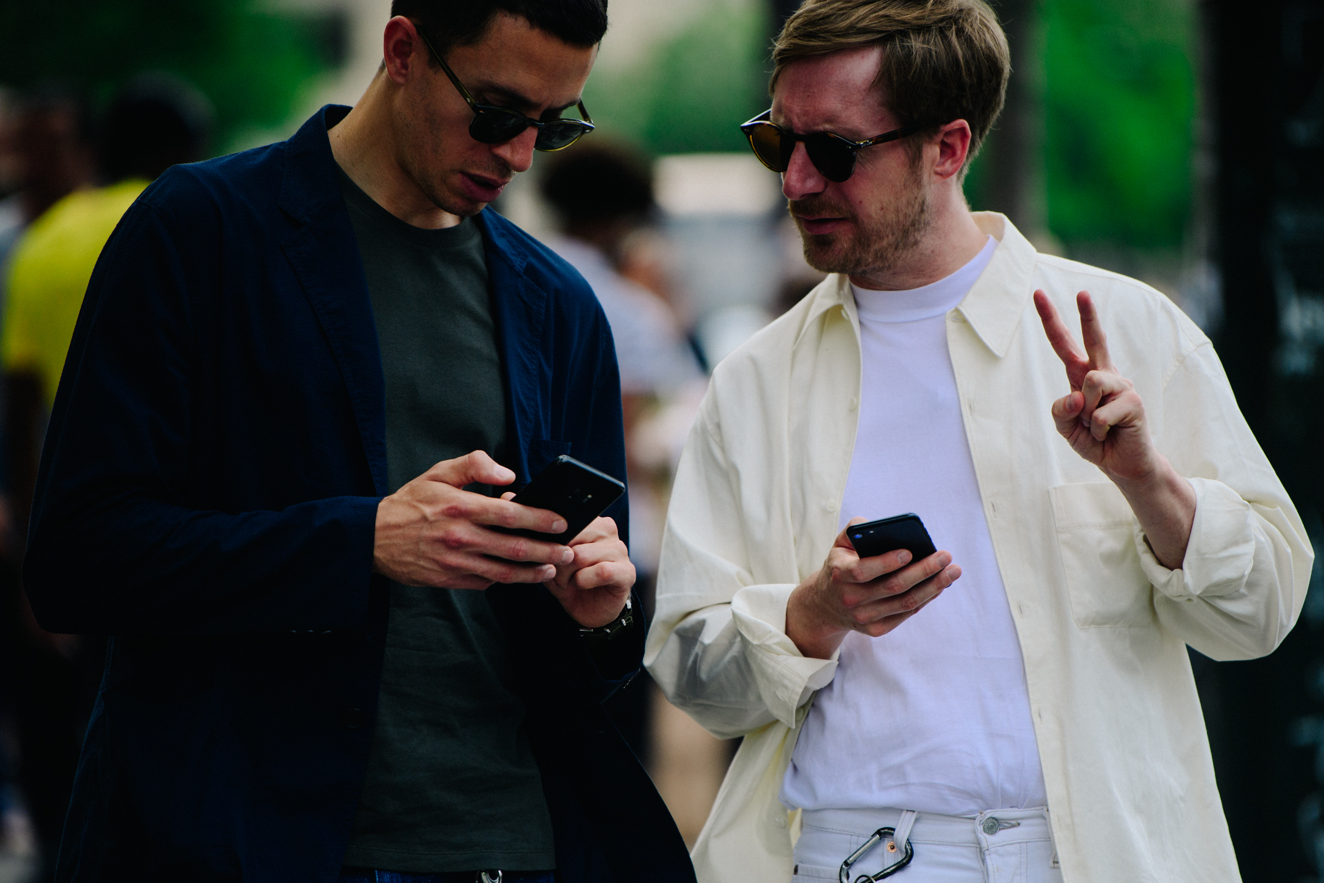 Two men wearing black and white shirts