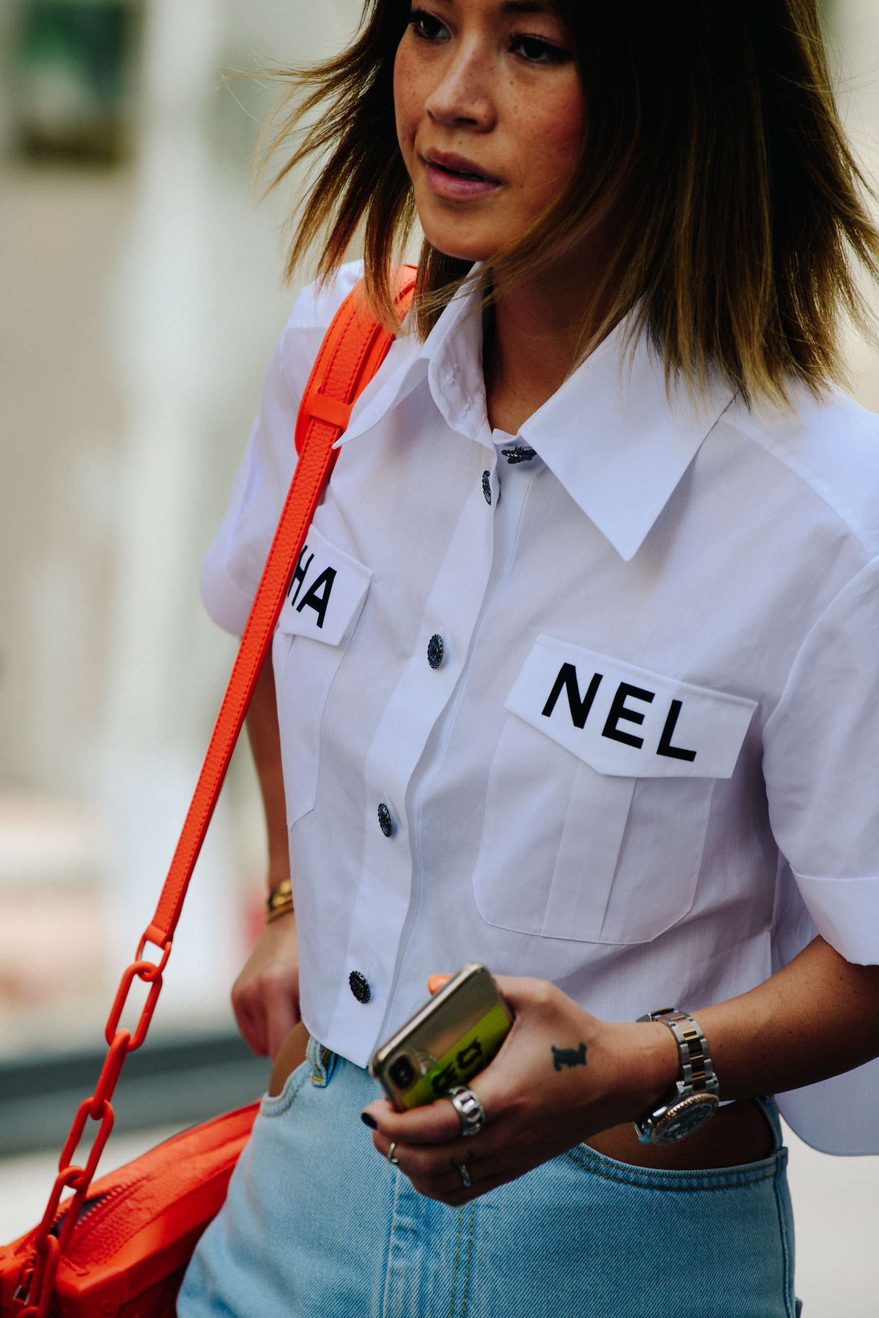 Woman wearing orange bag