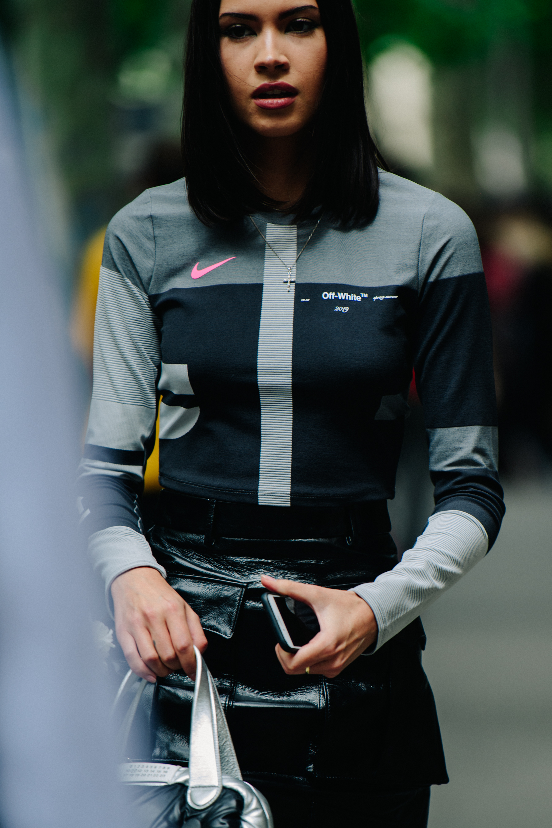 Woman wearing Off-White Nike top