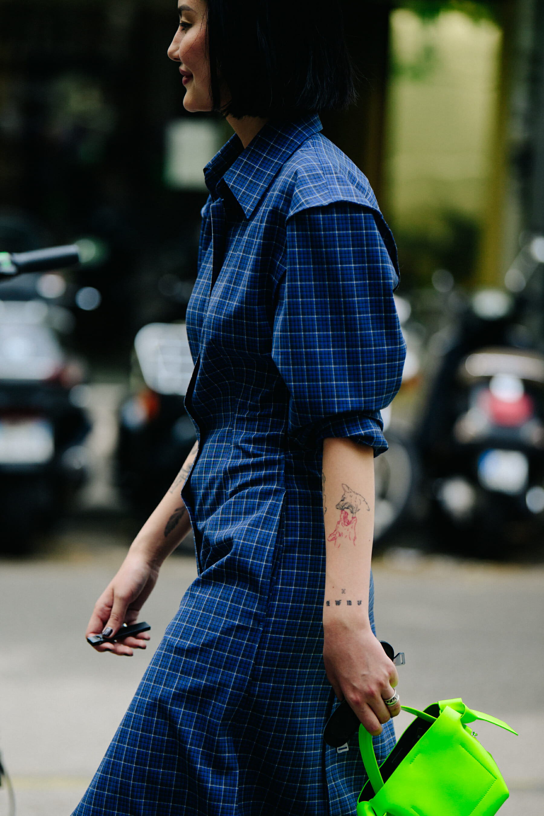 Woman wearing blue check dress